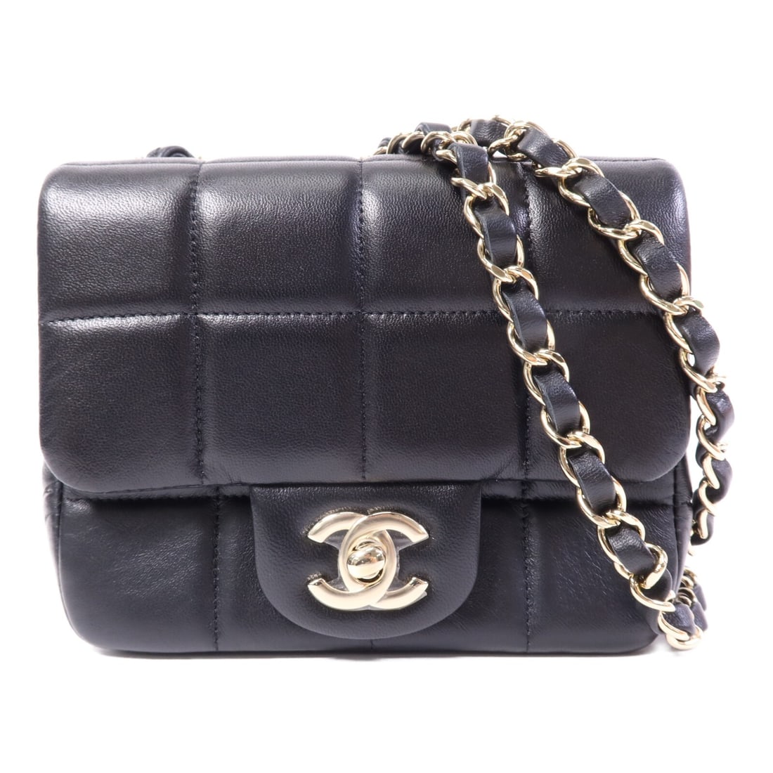 CHANEL Chocolate Bar Mini Flap Shoulder Bag Black Calfskin GHW: CHANEL Chocolate Bar Mini Flap Shoulder Bag Black Calfskin GHW A CHANEL mini flap shoulder bag in black calfskin leather with a CC turn-lock closure and gold-tone hardware. It features a structured de