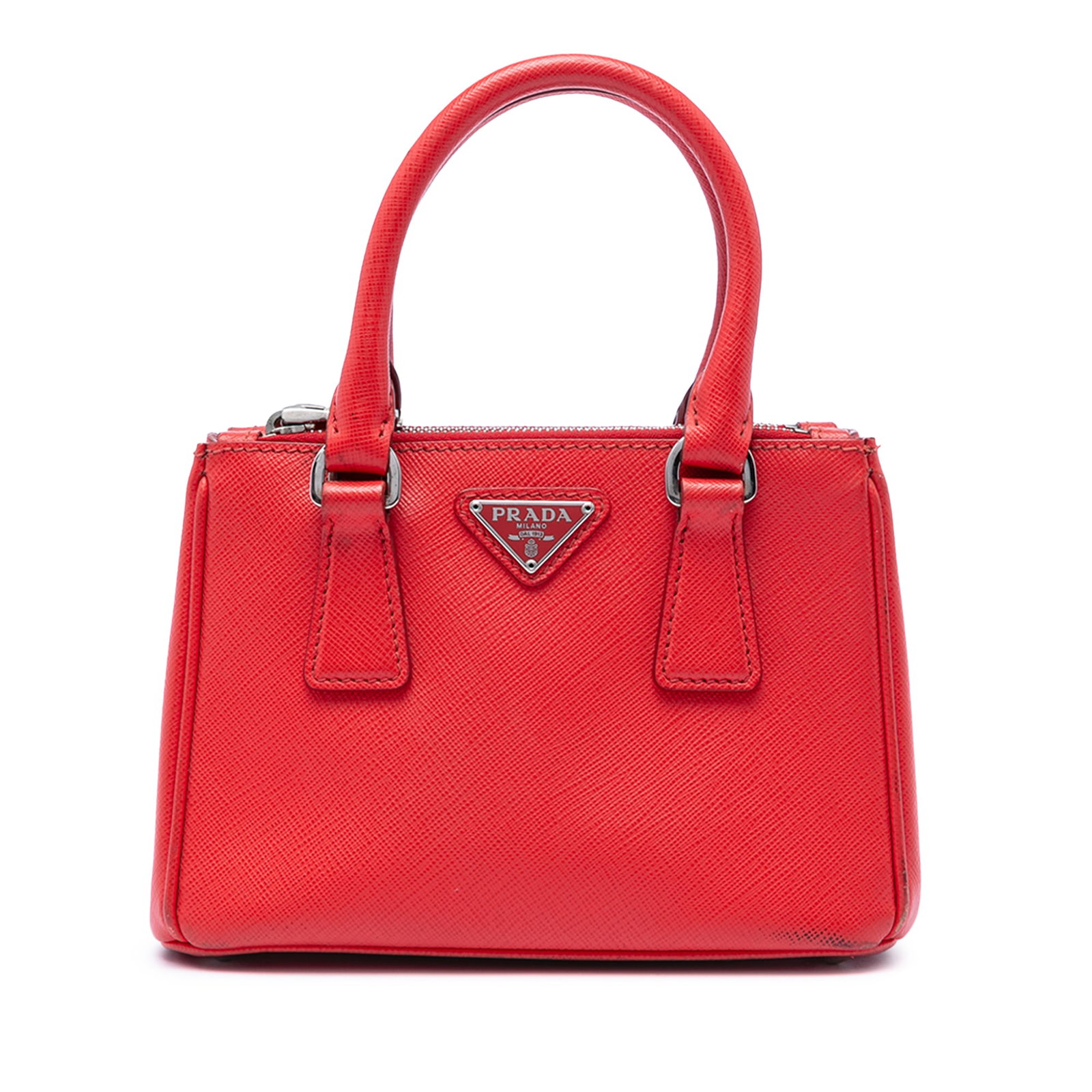 Prada Galleria Mini Double Zip Satchel in Red Saffiano Leather: Prada Galleria Mini Double Zip Satchel in Red Saffiano Leather Prada Mini Saffiano Lux Galleria Double Zip Satchel in red leather, made in Italy. This bag features a saffiano leather body, rolled leat