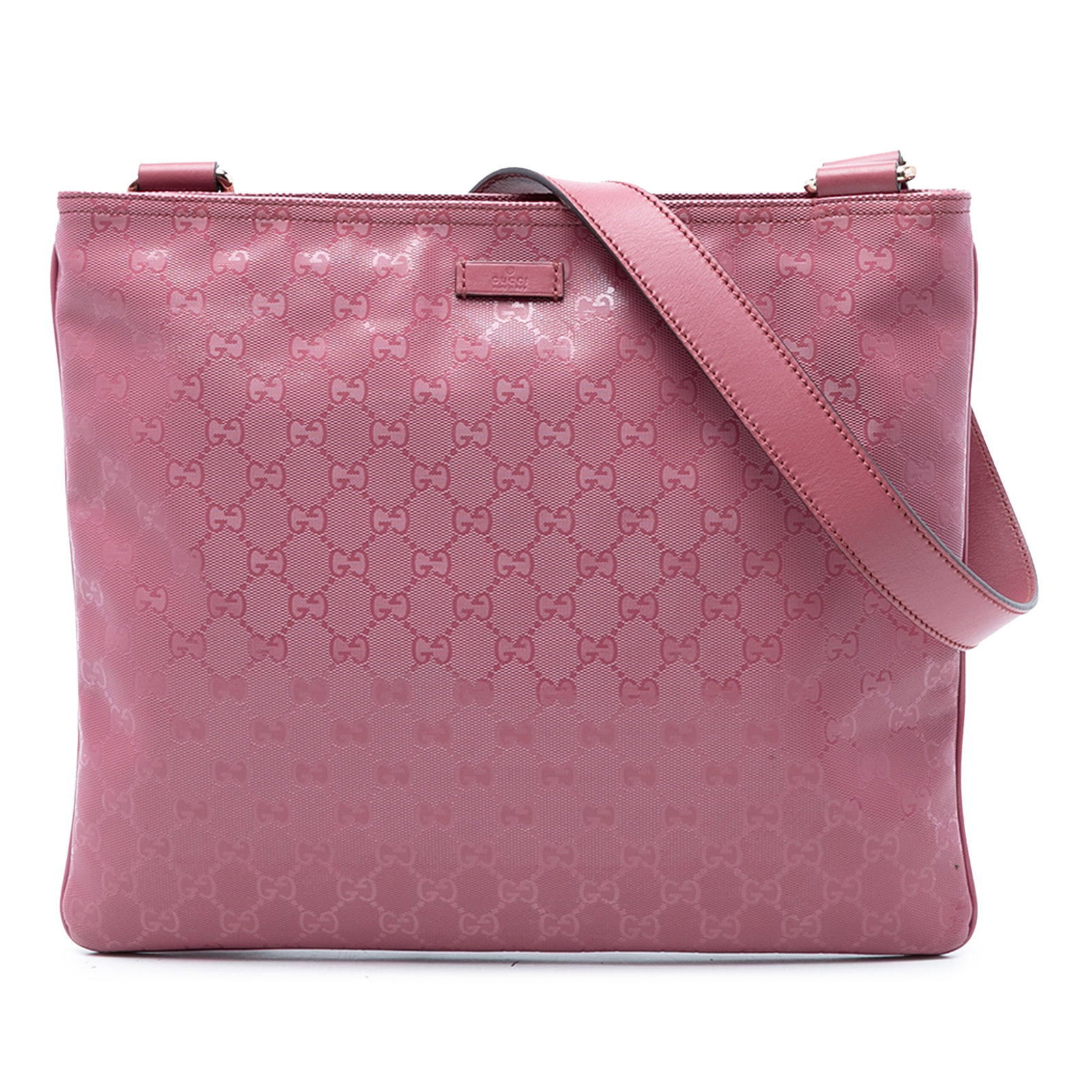Gucci GG Imprime Pink Coated Canvas Crossbody Bag: Gucci GG Imprime Pink Coated Canvas Crossbody Bag Gucci GG Imprime crossbody bag in pink coated canvas with an adjustable flat leather strap and top zip closure. The interior includes one zip pocket a