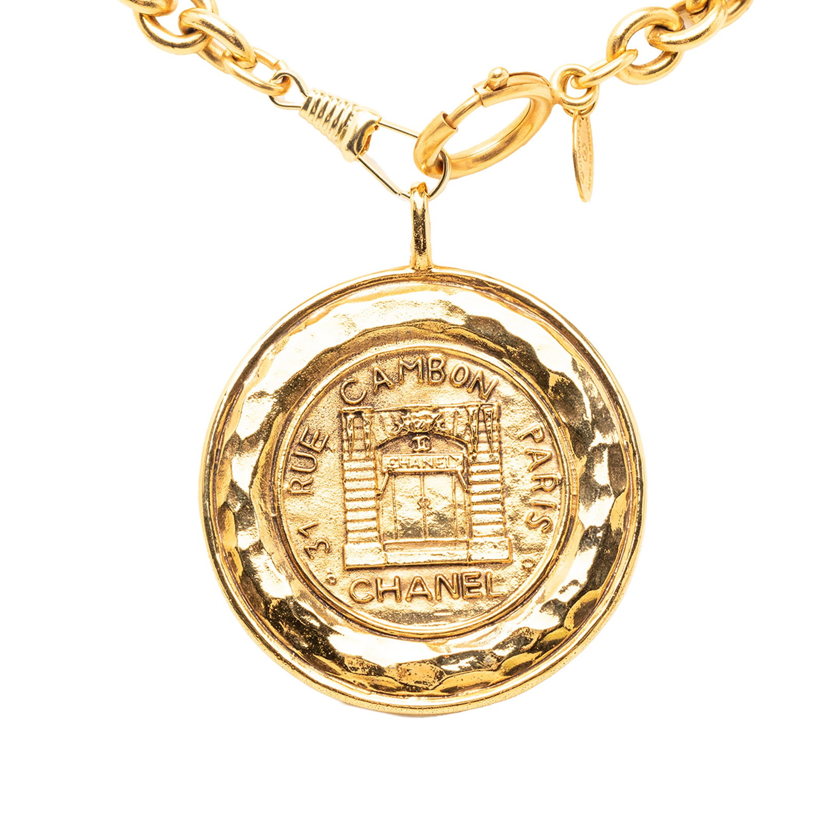 Chanel 31 Rue Cambon Medallion Gold Tone Pendant Necklace: Chanel 31 Rue Cambon Medallion Gold Tone Pendant Necklace This Chanel necklace features a gold-tone metal medallion pendant and a spring ring closure. The design is part of the 31 Rue Cambon collectio