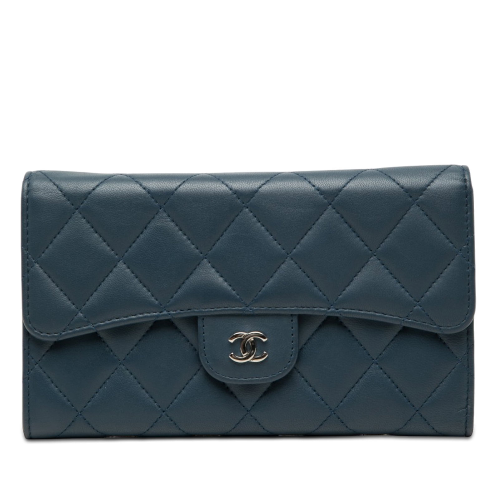 Chanel Classic Flap CC Quilted Lambskin Wallet Blue: Chanel Classic Flap CC Quilted Lambskin Wallet Blue A Chanel Classic Flap wallet crafted in blue quilted lambskin leather. It features a front flap with snap closure, an exterior back slip pocket, and
