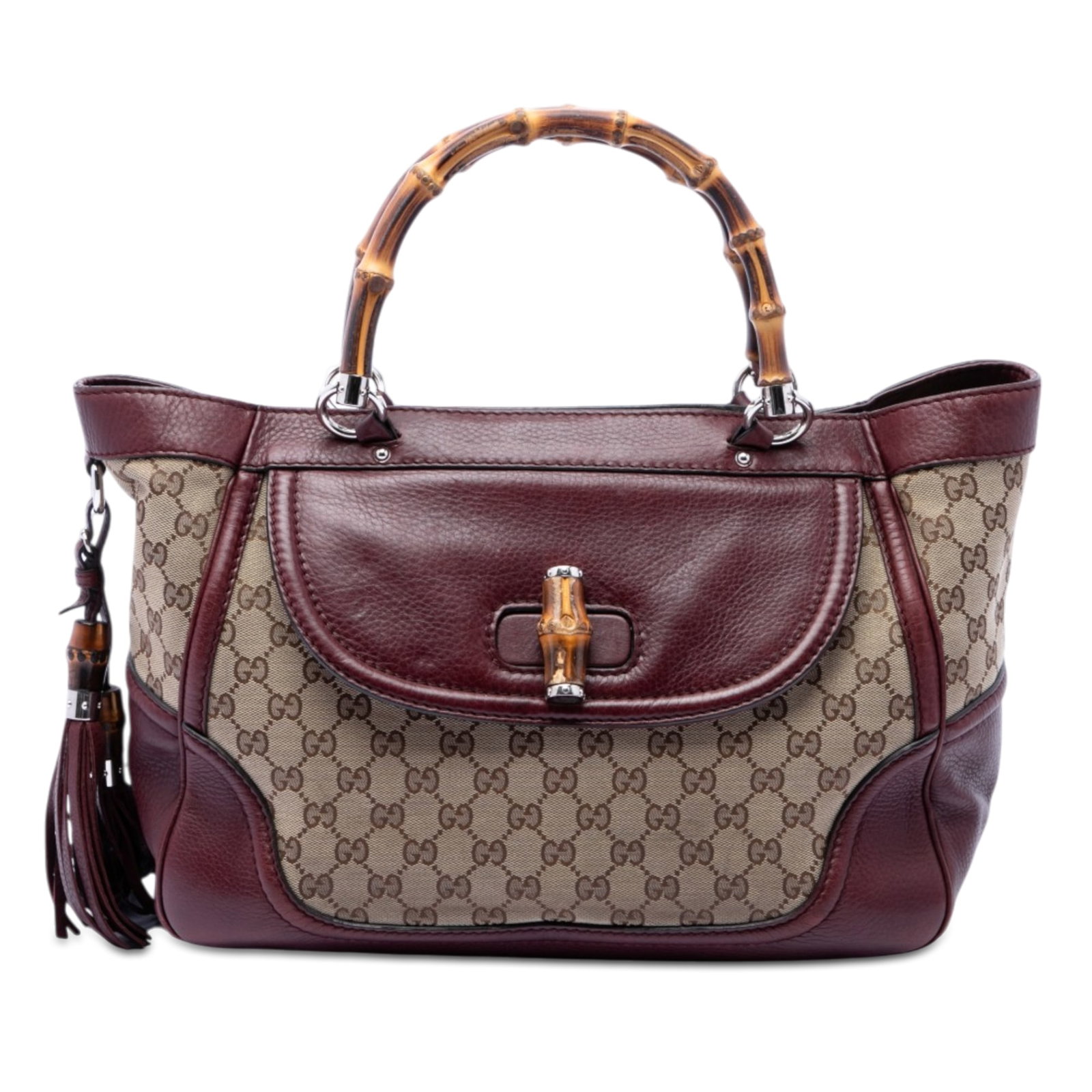 Gucci New Bamboo Tassel Medium GG Canvas Tote Bag: Gucci New Bamboo Tassel Medium GG Canvas Tote Bag Gucci Medium GG Canvas New Bamboo Tassel Tote crafted with a canvas body and leather trim. It features bamboo top handles, an open top with magnetic
