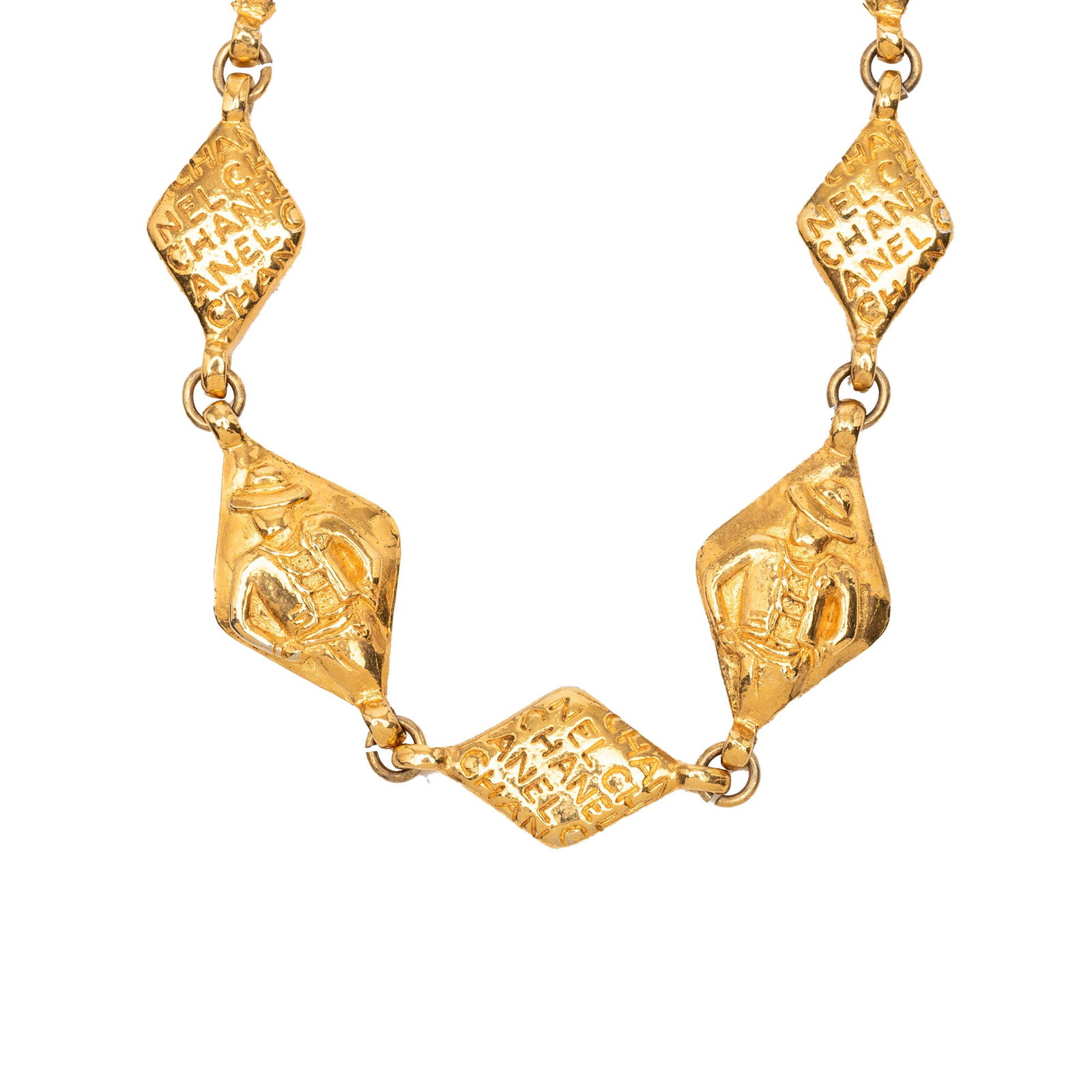 Chanel logo chain necklace in gold tone metal: Chanel logo chain necklace in gold tone metal Chanel logo chain necklace in gold-tone metal with a spring ring closure. This costume jewelry piece is made in France and shows visible wear, including s