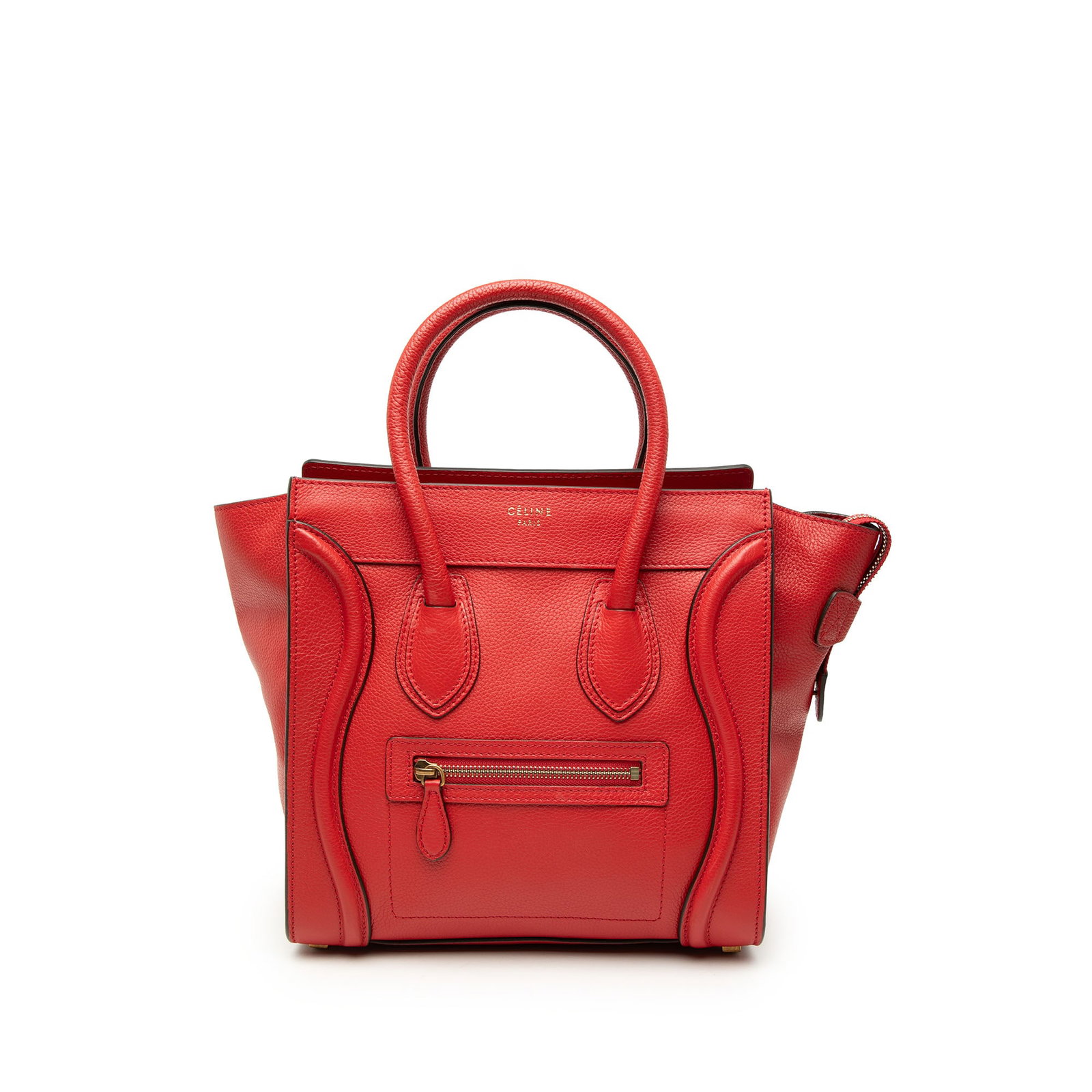 Celine Micro Luggage Tote in Red Drummed Calfskin Leather: Celine Micro Luggage Tote in Red Drummed Calfskin Leather Celine Micro Drummed Calfskin Luggage Tote in red leather. This tote features rolled leather handles, a top zip closure, an exterior front zip