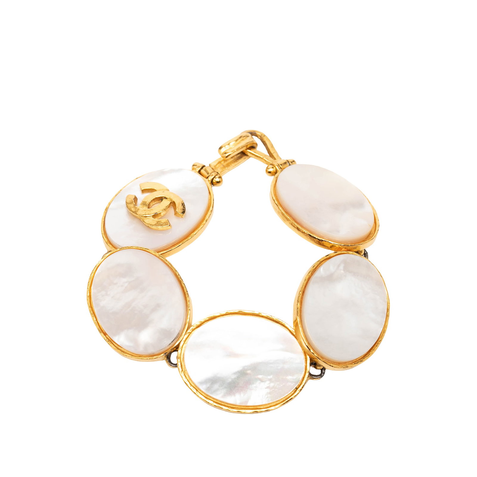 Chanel cuff bracelet gold plated mother of pearl hook closure: Chanel cuff bracelet gold plated mother of pearl hook closure This Chanel cuff bracelet features a gold-plated metal body accented with mother of pearl and is secured with a hook closure. The piece is