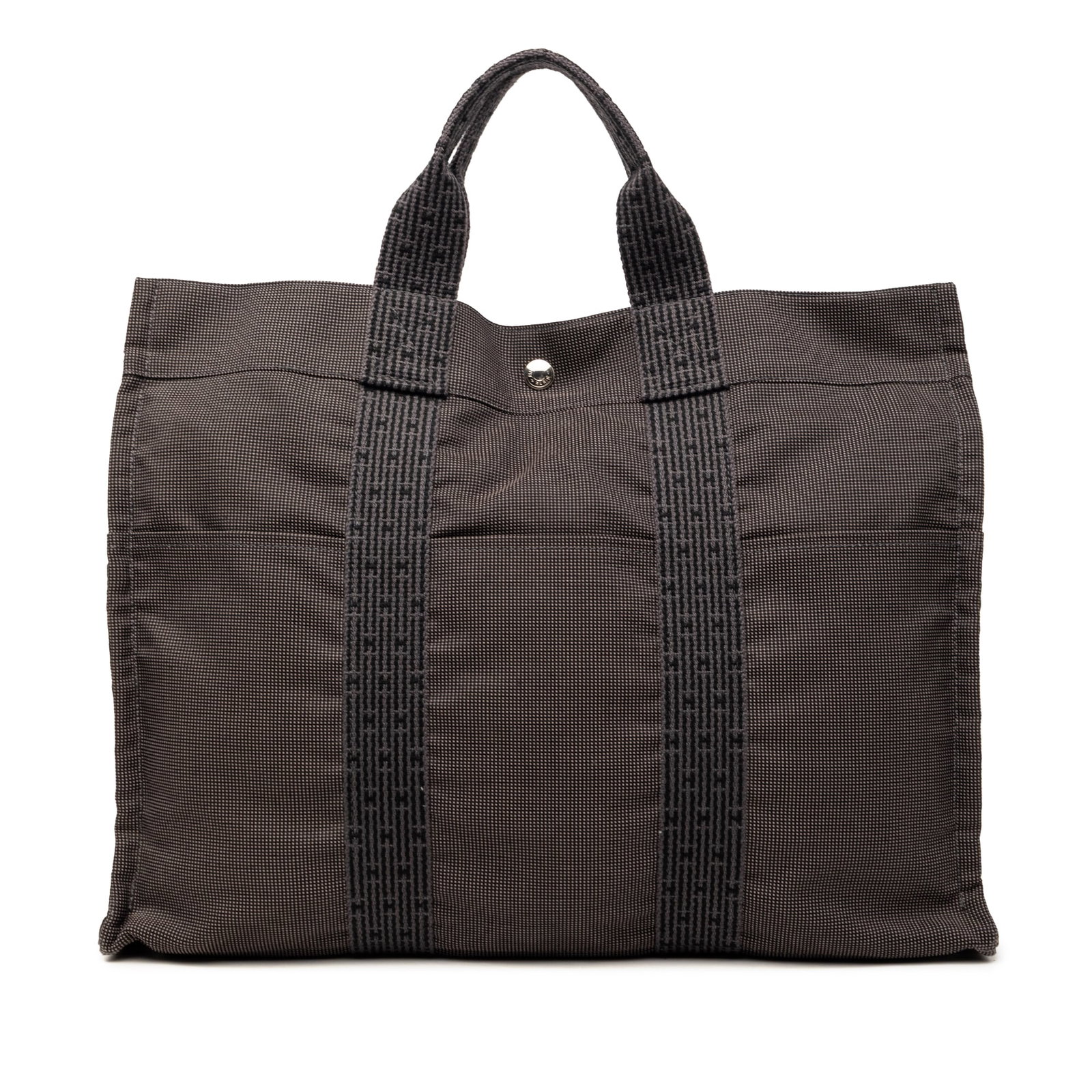 Hermes Herline MM Brown Canvas Tote Bag: Hermes Herline MM Brown Canvas Tote Bag This Hermes Herline MM tote bag is crafted from durable brown canvas and features flat handles, a top zip closure, exterior front and back slip pockets, and an 