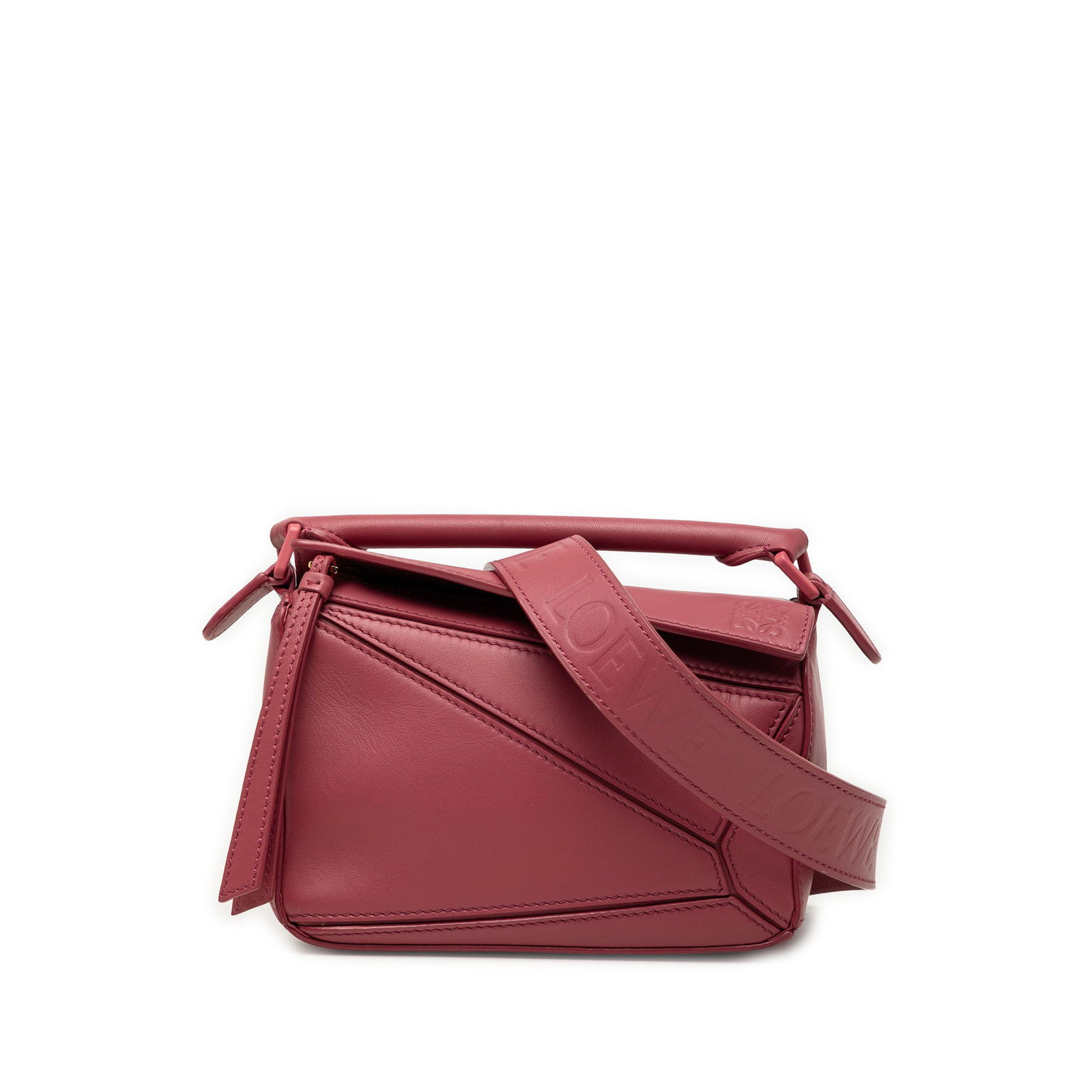 LOEWE Puzzle Mini Leather Satchel with Detachable Strap: LOEWE Puzzle Mini Leather Satchel with Detachable Strap LOEWE Mini Puzzle satchel crafted in pink leather with the signature structured silhouette. This bag features a flat leather top handle, a detac