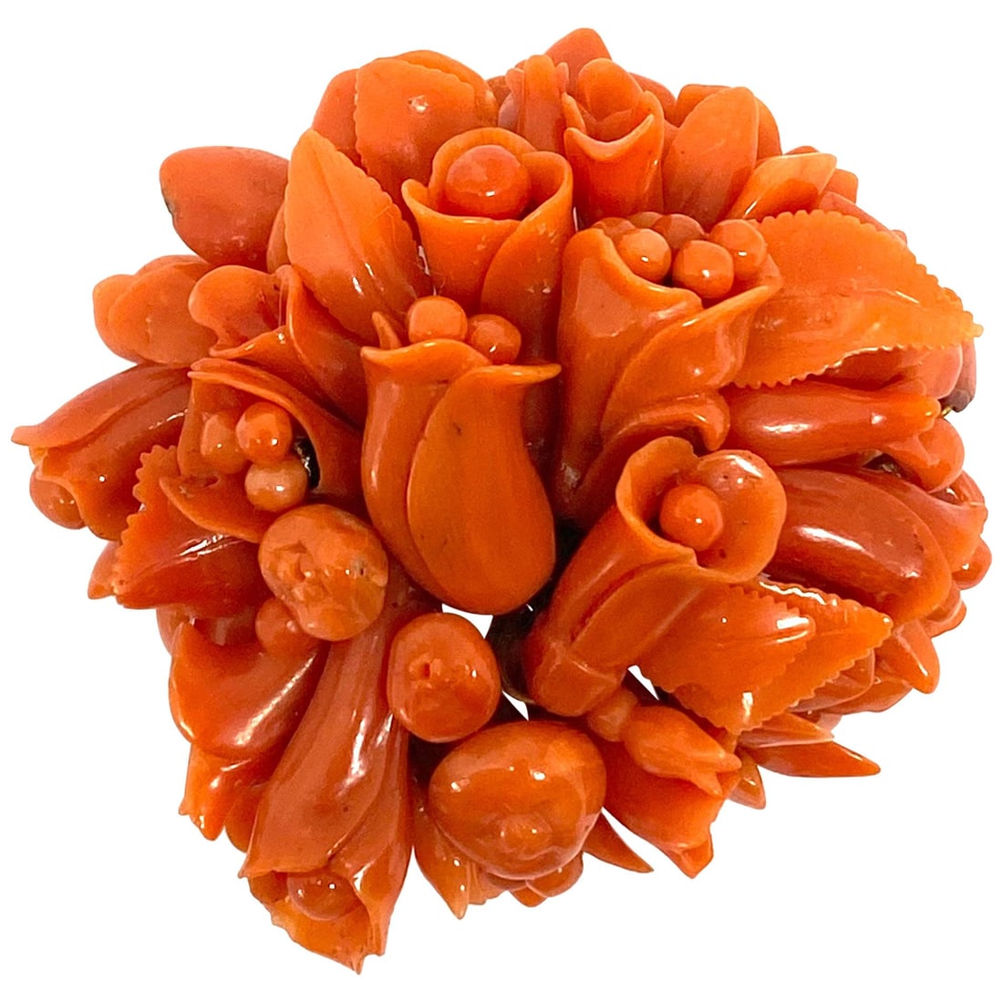 Victorian 9K Yellow Gold Coral Brooch with Carved Floral Motif: Victorian 9K Yellow Gold Coral Brooch with Carved Floral Motif Victorian brooch featuring Mediterranean coral in an uncut form, set in 9K yellow gold. This handmade piece showcases a 3D floral carved 