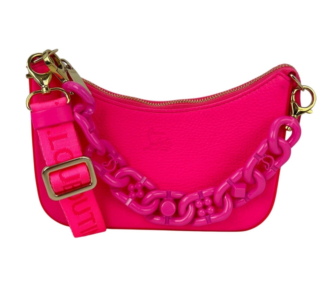 Christian Louboutin Christian Gomme Mini Pink Leather Shoulder Bag: Christian Louboutin Christian Gomme Mini Pink Leather Shoulder Bag Pre-owned Christian Louboutin Gomme Mini Loubila shoulder bag in pink with a crescent silhouette and zip closure. This mini bag featu