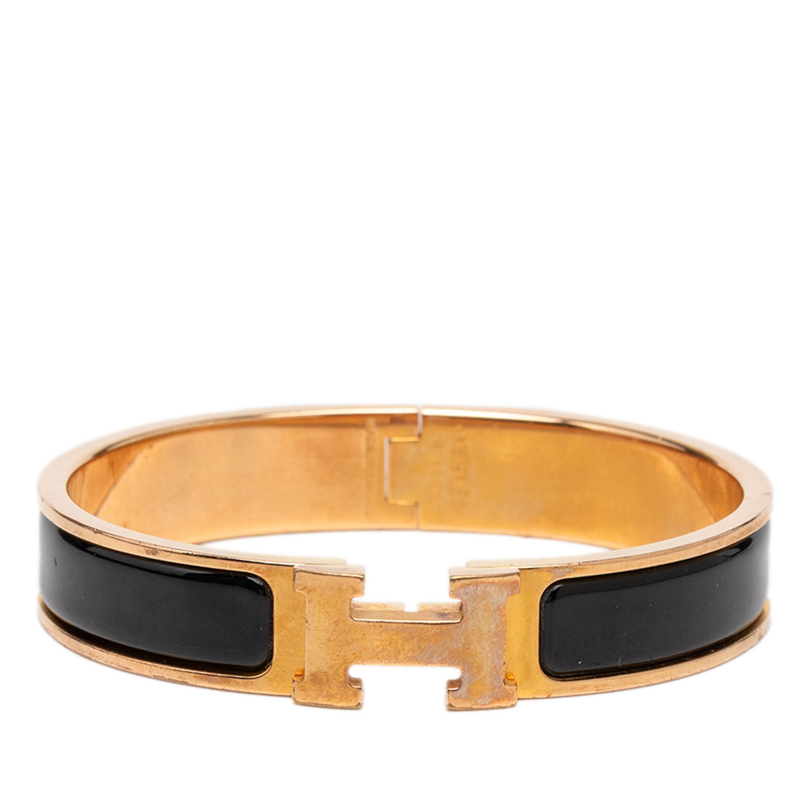 Hermes Clic H PM narrow enamel bracelet gold plated black: Hermes Clic H PM narrow enamel bracelet gold plated black Hermes Narrow Enamel Clic H Bracelet PM with an enamel body, gold-plated metal accents, and a metal clasp closure. This bracelet is made in Fr