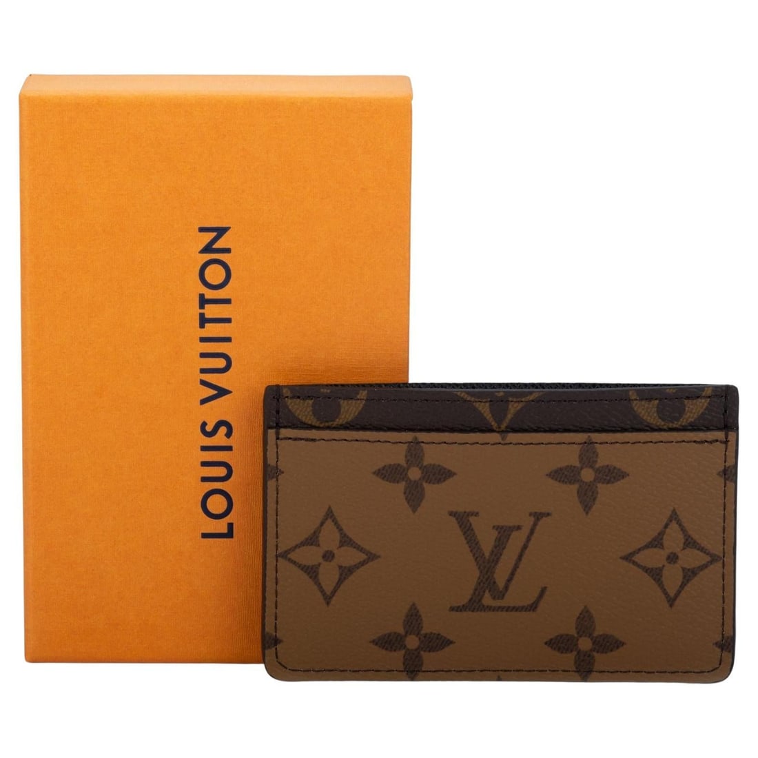 Louis Vuitton two tone monogram card holder with box: Louis Vuitton two tone monogram card holder with box Louis Vuitton two-tone monogram credit card case with a large logo design. This un-used unisex accessory comes with the original box and dustcover.
