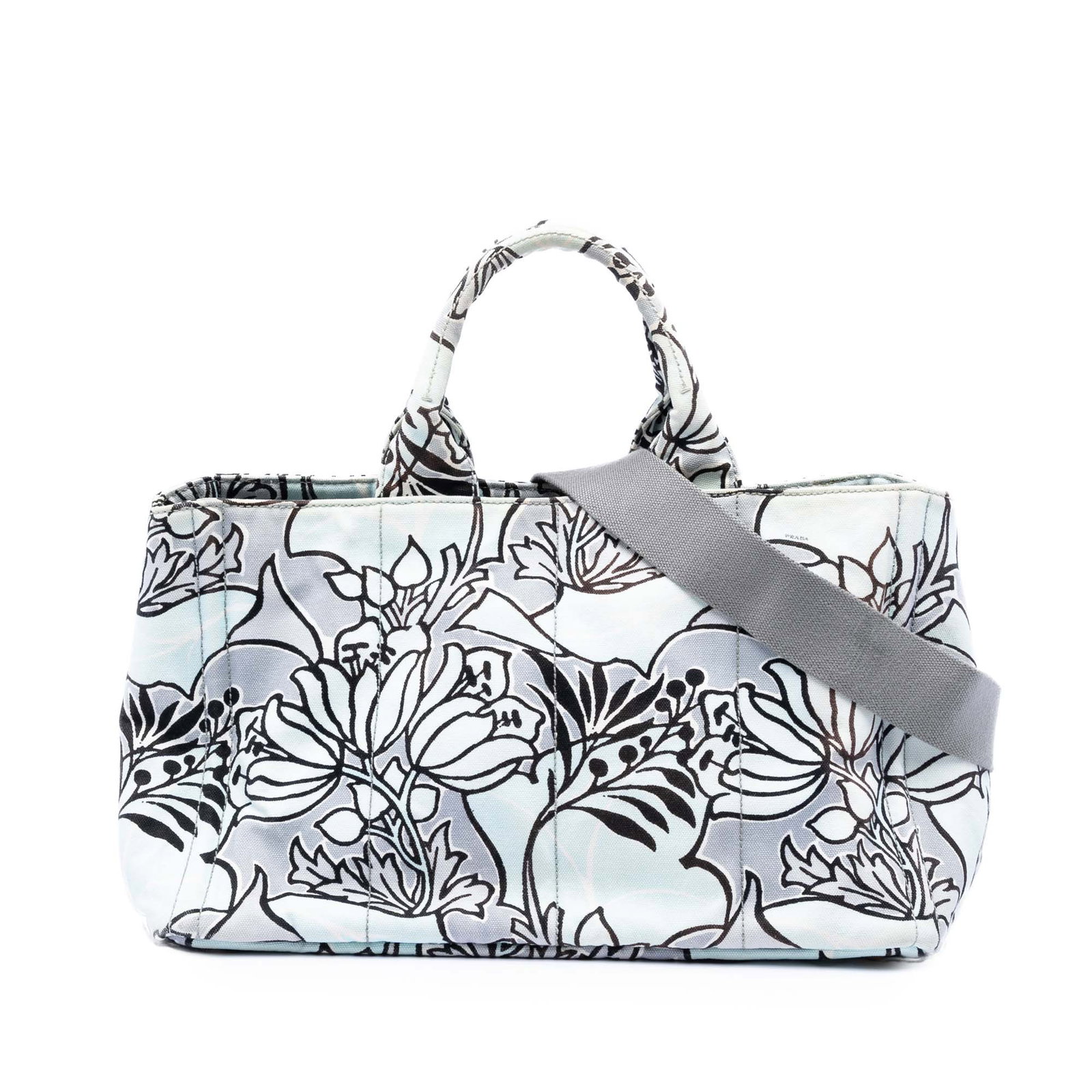 Prada Canapa Blue Canvas Satchel with Floral Print and Detachable Strap: Prada Canapa Blue Canvas Satchel with Floral Print and Detachable Strap This Prada Medium Floral Printed Canvas Canapa Satchel showcases a vibrant floral print on canvas with rolled handles and a deta