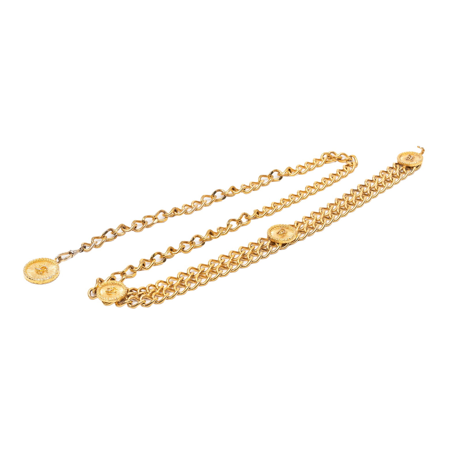 Chanel chain-link medallion belt in gold-tone metal: Chanel chain-link medallion belt in gold-tone metal Chanel CC medallion belt with a gold-tone chain-link design and hook closure. Made in France, this accessory shows visible wear including discolorat