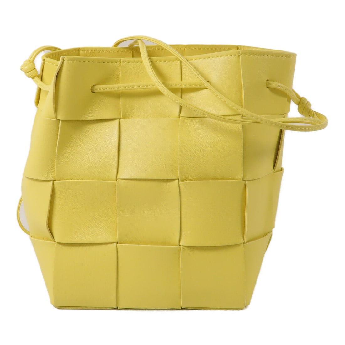 Bottega Veneta Cassette Yellow Lambskin Bucket Shoulder Bag: Bottega Veneta Cassette Yellow Lambskin Bucket Shoulder Bag A BOTTEGA VENETA Cassette Bucket Shoulder Bag in yellow lambskin leather. This women's regular-size shoulder bag was made in Italy and is pr