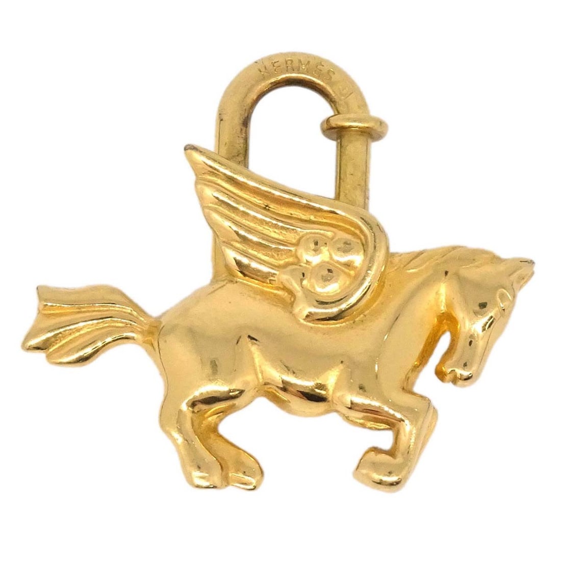 Hermes Le Cheval Pegasus Cadena Charm Gold Plated 1993: Hermes Le Cheval Pegasus Cadena Charm Gold Plated 1993 Vintage Hermes Le Cheval Pegasus Cadena charm from 1993 in gold plated finish. This small unisex charm is made in France and shows minor dirt and