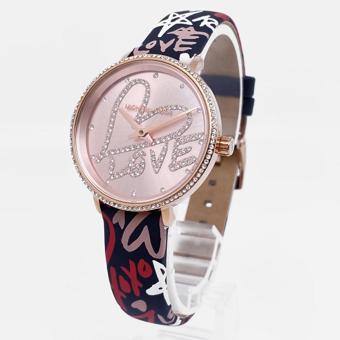 Michael Kors Pyper womens quartz watch pink dial 32 mm MK2848: Michael Kors Pyper womens quartz watch pink dial 32 mm MK2848 Michael Kors Mini Pyper ladies quartz wristwatch with a pink analog dial and round gold-tone PVD-coated stainless steel case. The dial fea