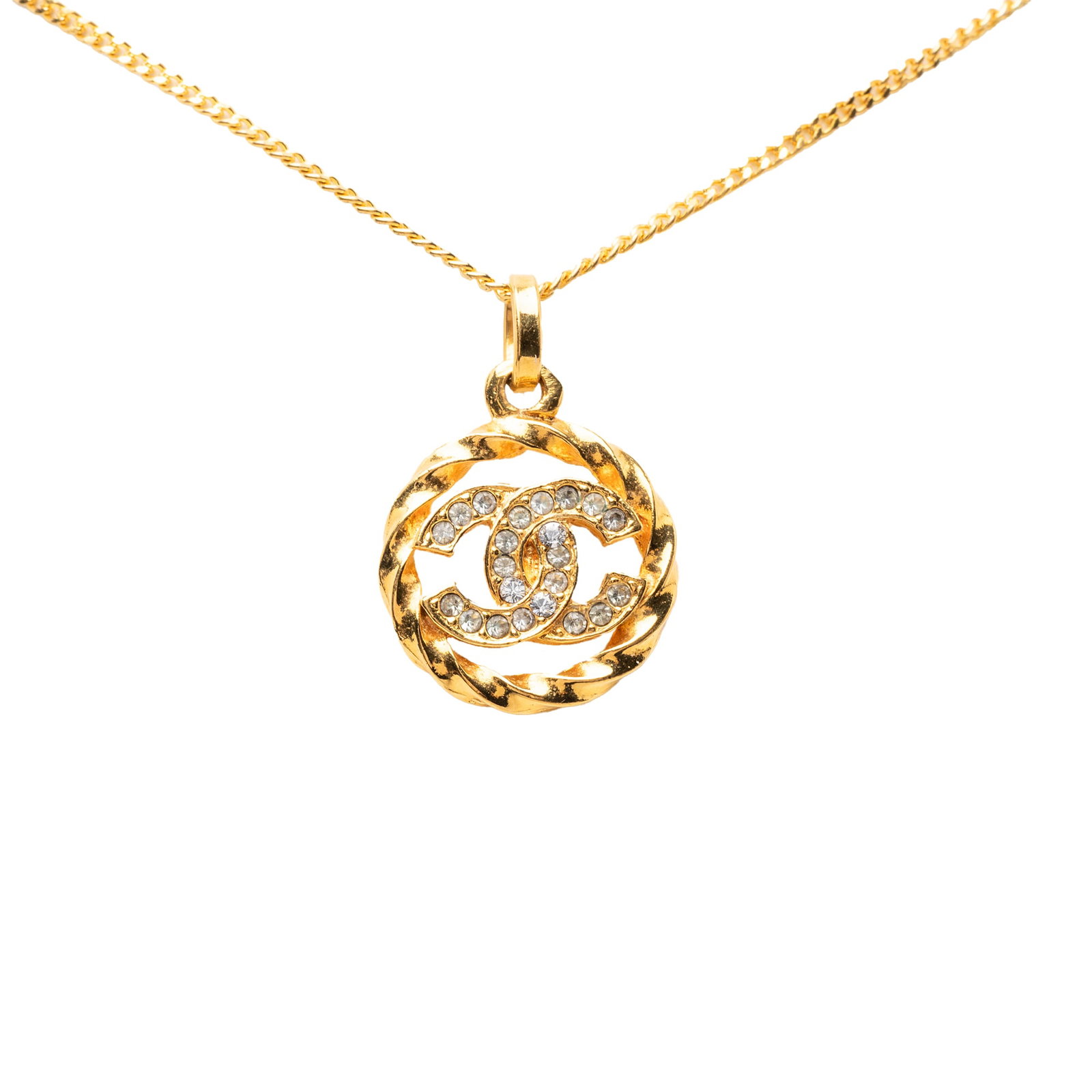 Chanel CC Round Pendant Necklace Gold Tone Metal Strass: Chanel CC Round Pendant Necklace Gold Tone Metal Strass Chanel round pendant necklace featuring a gold tone metal body with rhinestone detailing and a spring ring closure. Condition is AB, with noted 