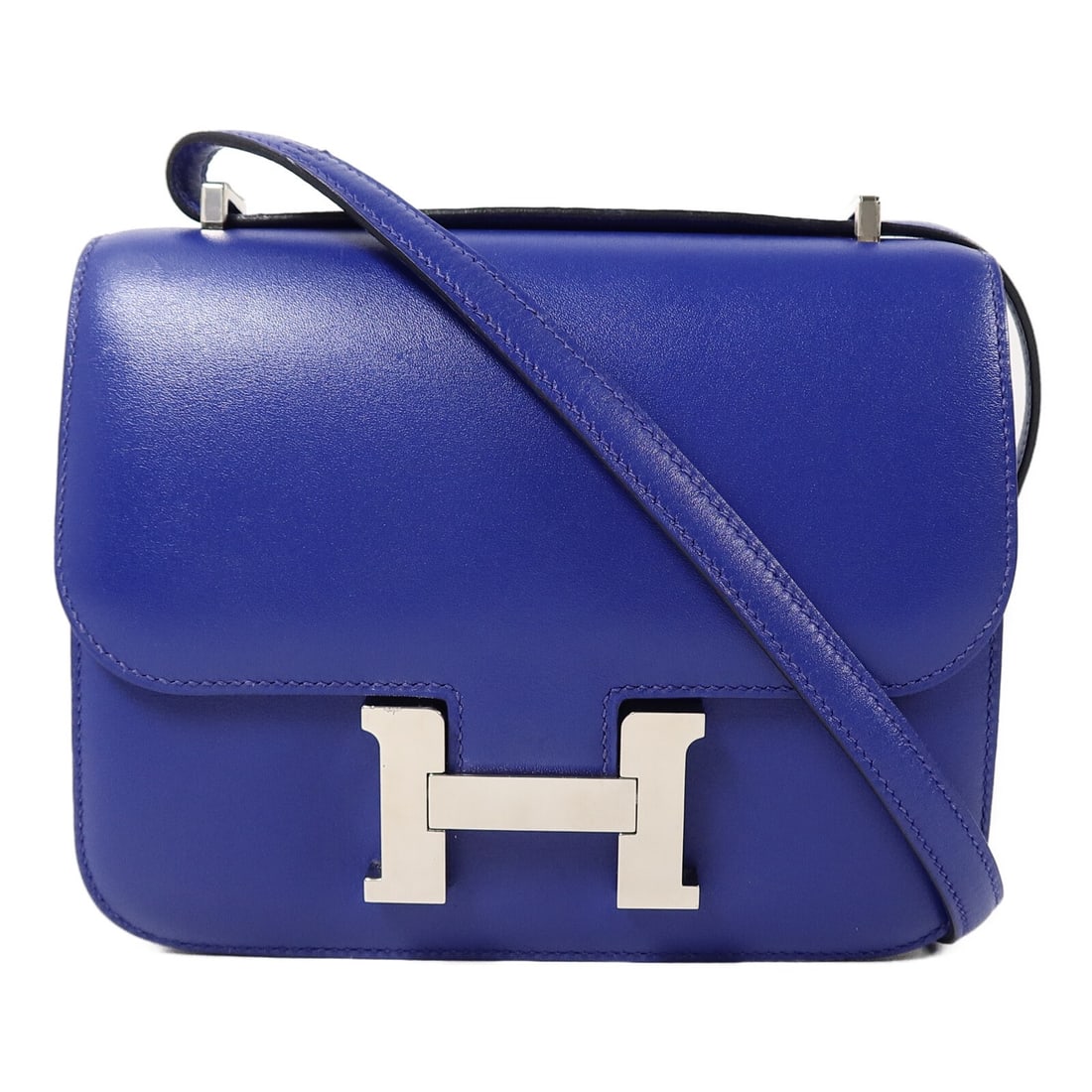 Hermes Constance Mini Box Calf Shoulder Bag Bleu Electrique PHW: Hermes Constance Mini Box Calf Shoulder Bag Bleu Electrique PHW A Hermes Constance Mini shoulder bag in Bleu Electrique, crafted from Box calf leather and calfskin (cowhide). It features a flap closur