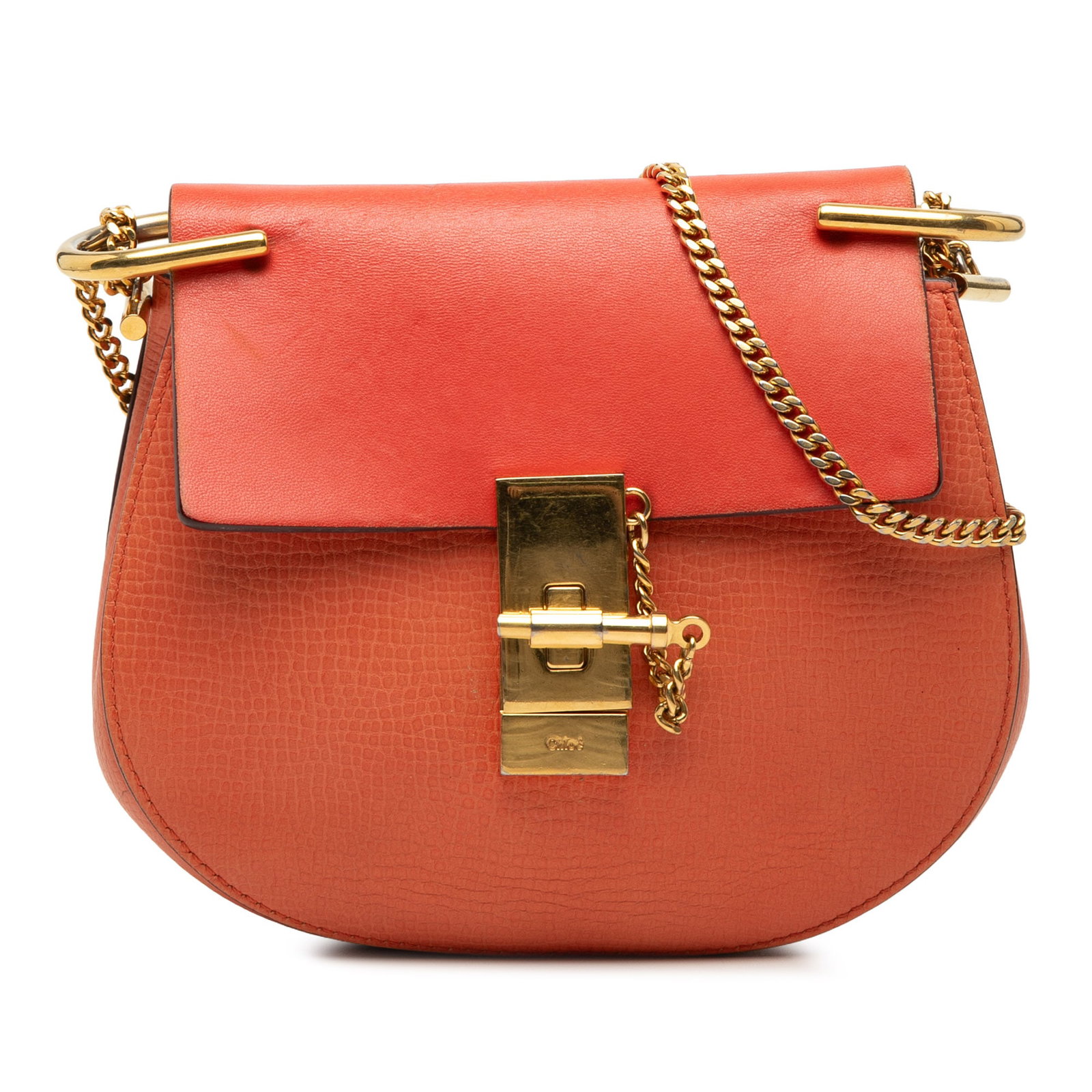 Chloe Drew Small Orange Leather Crossbody Bag: Chloe Drew Small Orange Leather Crossbody Bag This Chloe Small Drew crossbody bag is crafted in leather with a structured silhouette and chain link shoulder strap. The design features a front flap wit