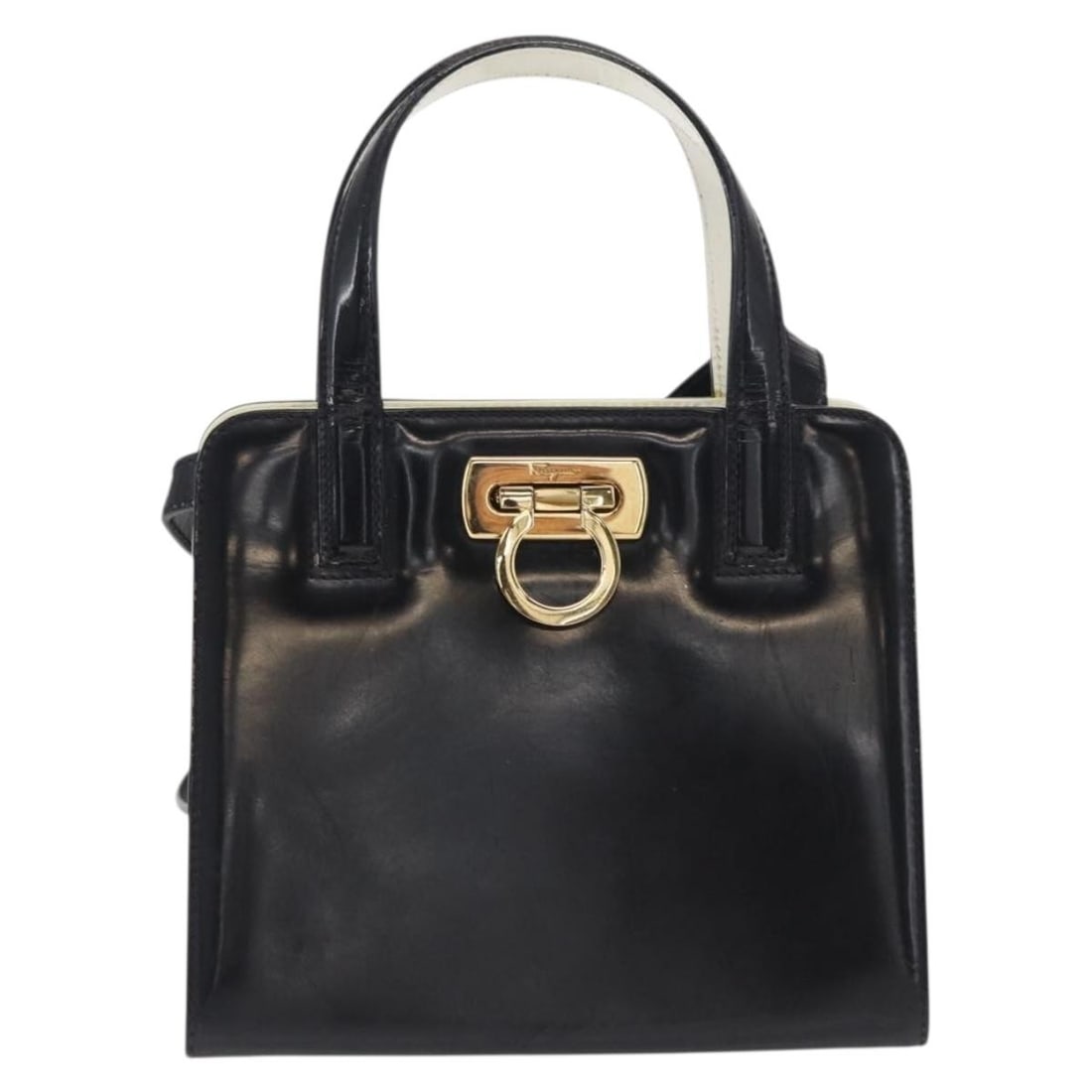Black Patent Leather Handbag Salvatore Ferragamo Gancini: Black Patent Leather Handbag Salvatore Ferragamo Gancini A Salvatore Ferragamo Gancini bag in black patent leather, designed for women and made in Italy. It measures 17 cm x 15 cm x 9 cm and is descri