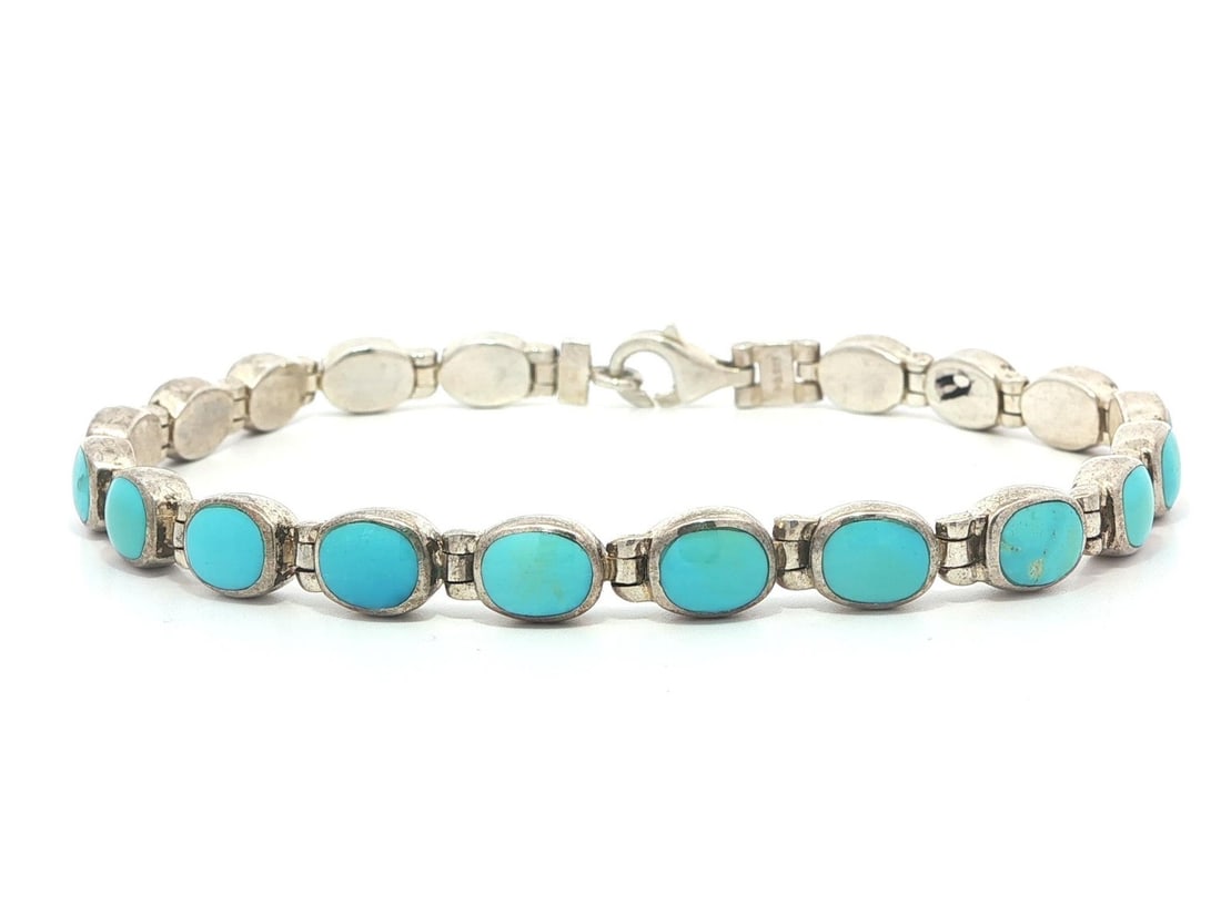 Sterling Silver Line Bracelet with Natural Turquoise Oval Cabochons Vintage: Sterling Silver Line Bracelet with Natural Turquoise Oval Cabochons Vintage This vintage line bracelet features nineteen oval cabochon-cut natural turquoise stones, each bezel set in solid sterling si