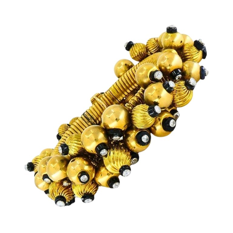 French Retro Tubogas Bracelet in 18k Gold Platinum Onyx Diamonds: French Retro Tubogas Bracelet in 18k Gold Platinum Onyx Diamonds Vintage retro bracelet from France, circa the 1950s, designed in a Tubogas style and decorated with multiple gold beads. The bracelet f