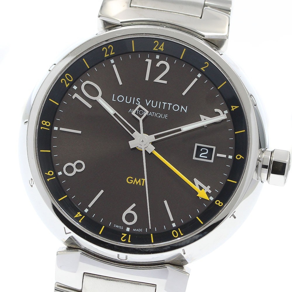 Louis Vuitton Tambour Q1155 mens automatic GMT date wristwatch: Louis Vuitton Tambour Q1155 mens automatic GMT date wristwatch Pre-owned Louis Vuitton Tambour automatic men's wristwatch with GMT and date functions. This Swiss-made watch features a brown dial and s