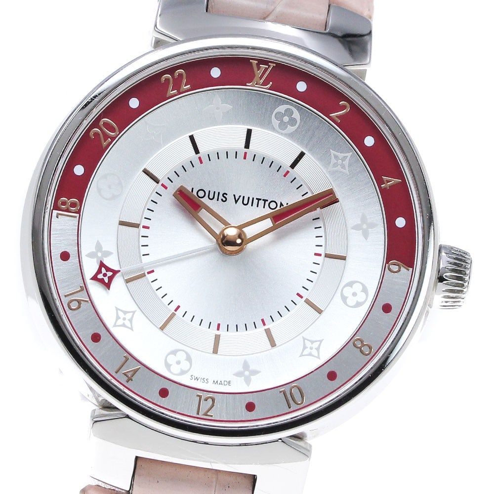 Louis Vuitton Tambour Moon Dual Time MM QA106 Ladies Quartz Watch: Louis Vuitton Tambour Moon Dual Time MM QA106 Ladies Quartz Watch Pre-owned Louis Vuitton Tambour Moon Dual Time MM women's wristwatch with a quartz movement and silver dial. This Swiss-made watch fea