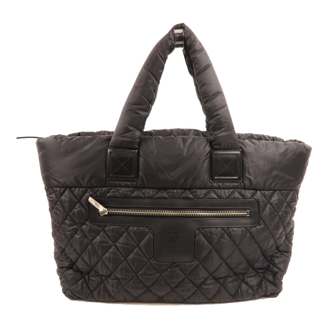 CHANEL Coco Cocoon CC Nylon Tote Bag Black: CHANEL Coco Cocoon CC Nylon Tote Bag Black CHANEL CC Coco Cocoon tote handbag in black nylon, designed for women and made in France. It features a regular size tote bag silhouette with black exterior 