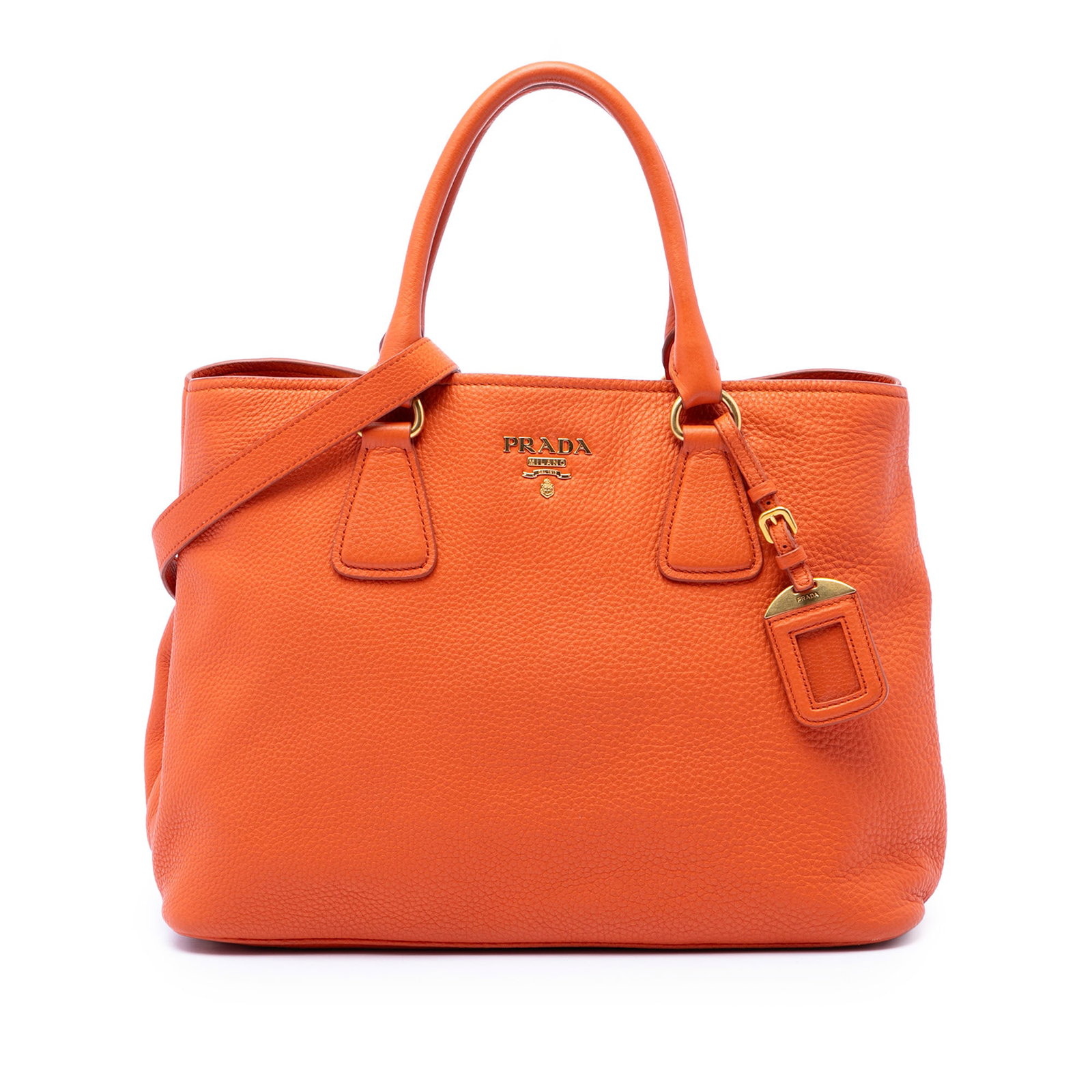 Prada Vitello Daino leather satchel with detachable strap: Prada Vitello Daino leather satchel with detachable strap Prada Vitello Daino Open Convertible Tote in orange leather with rolled handles, a detachable flat leather strap, and an open-top design. The 