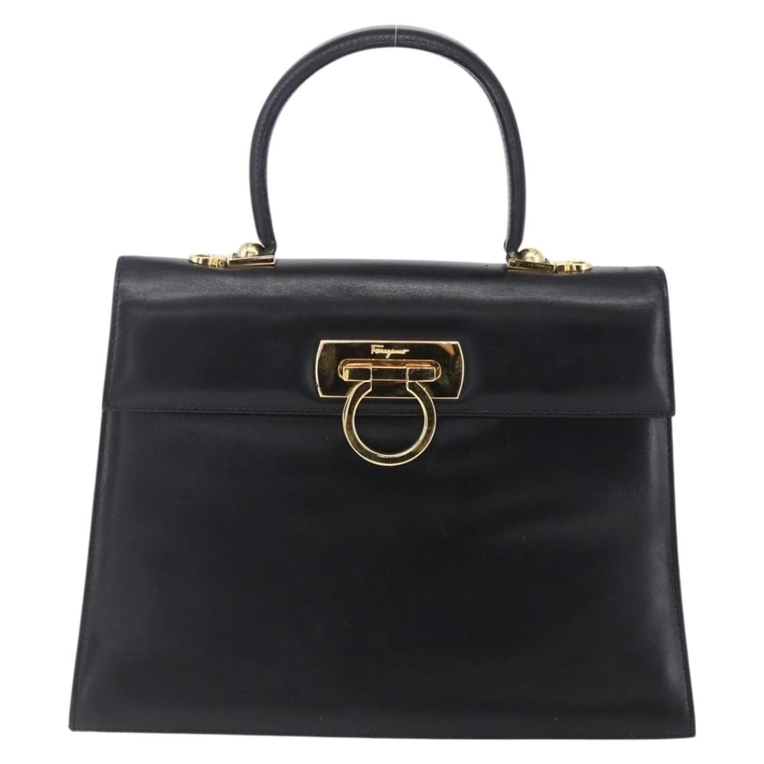 Black Leather Handbag Salvatore Ferragamo Gancini Italy: Black Leather Handbag Salvatore Ferragamo Gancini Italy This pre-owned Salvatore Ferragamo Gancini handbag features a classic black leather exterior with metal fittings. Designed for women, the handba