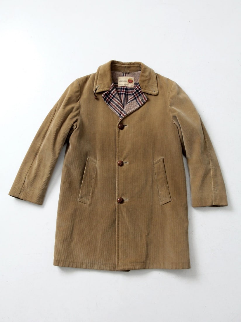 1960s Vintage Zero King Tan Corduroy Overcoat with Plaid Lining: 1960s Vintage Zero King Tan Corduroy Overcoat with Plaid Lining Step back in time with this authentic 1960s vintage Zero King overcoat. Crafted from classic tan corduroy, this stylish coat is designed