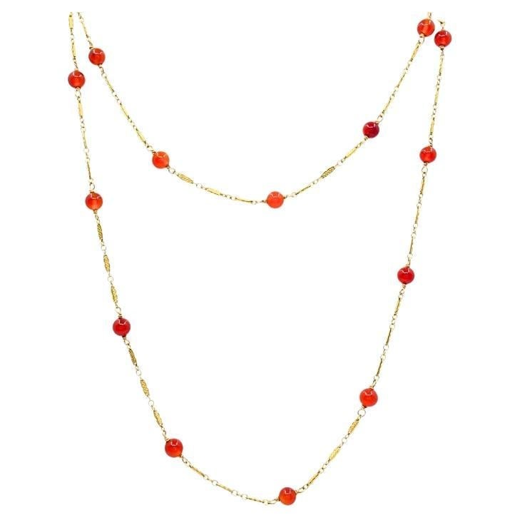 29 in Carnelian Bead Necklace in 14k Gold Vintage 1950s: 29 in Carnelian Bead Necklace in 14k Gold Vintage 1950s This vintage necklace features carnelian bead stones set along a 14k gold chain with decorative filigree gold stations. It has a 29 in length, a