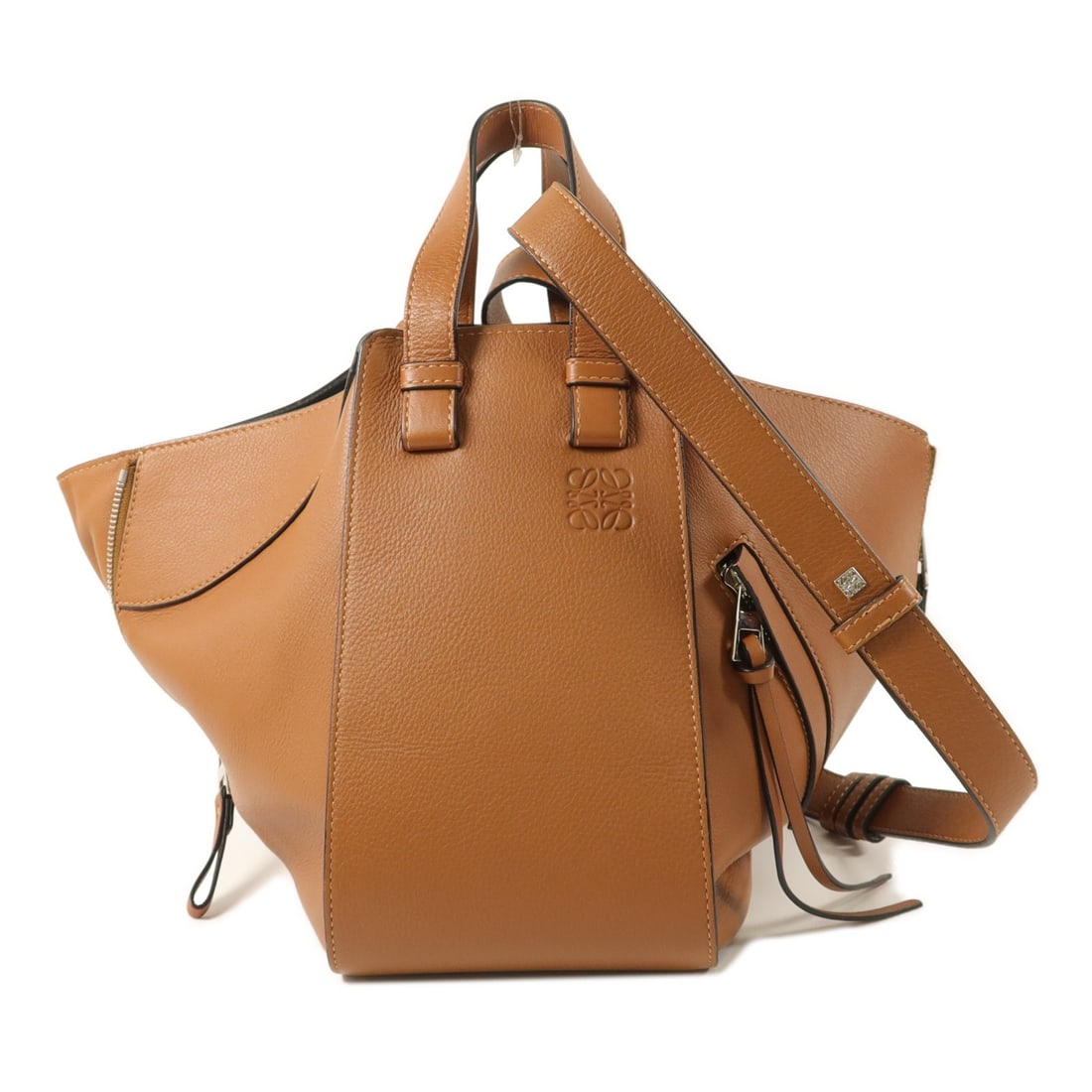 LOEWE Hammock Medium Brown Calfskin 2 Way Shoulder Bag: LOEWE Hammock Medium Brown Calfskin 2 Way Shoulder Bag A LOEWE Hammock Medium 2-way shoulder bag in brown and tan calfskin (cowhide). This women's bag features a regular size profile, brown frame colo