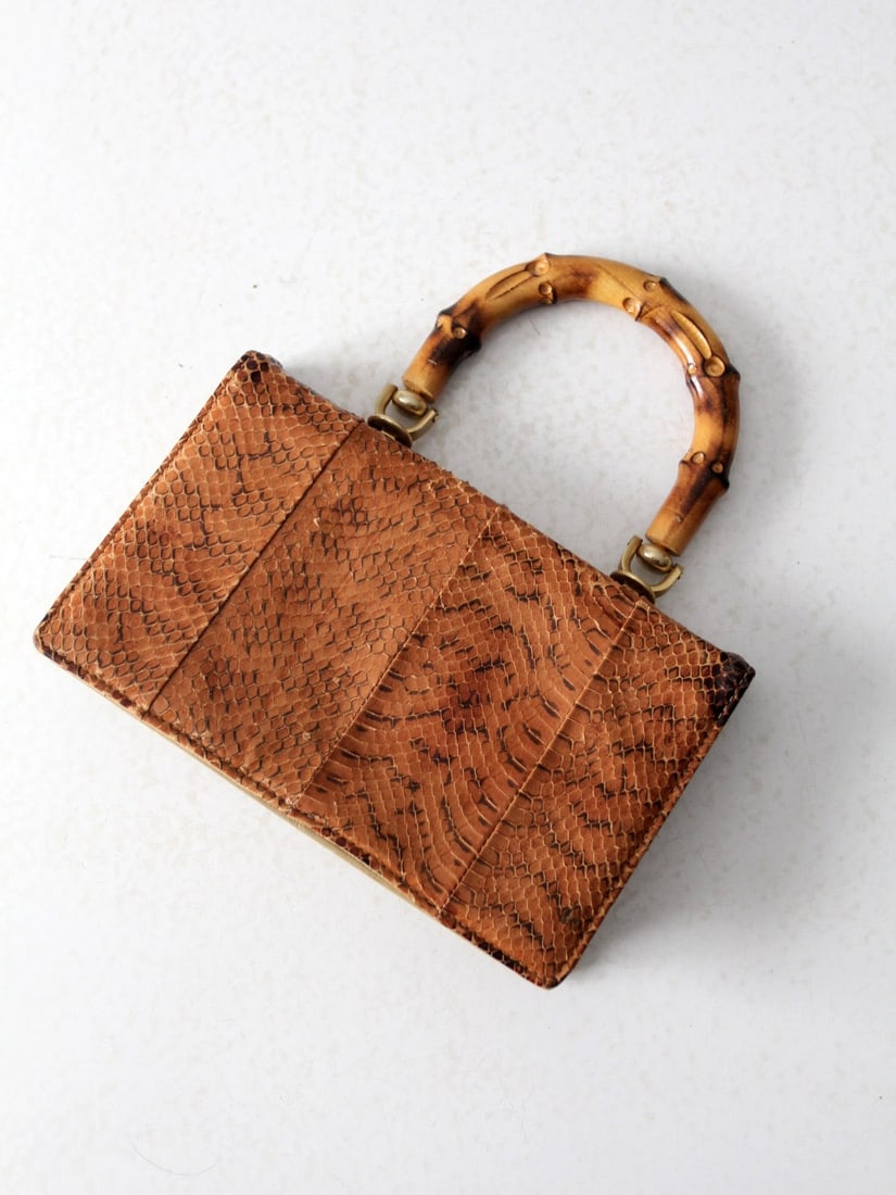 Vintage Brown Reptile Skin Accordion Hand Bag with Bamboo Handles: Vintage Brown Reptile Skin Accordion Hand Bag with Bamboo Handles This exquisite vintage accordion clutch is made from genuine reptile skin, showcasing a rich brown hue and a beautifully textured surf