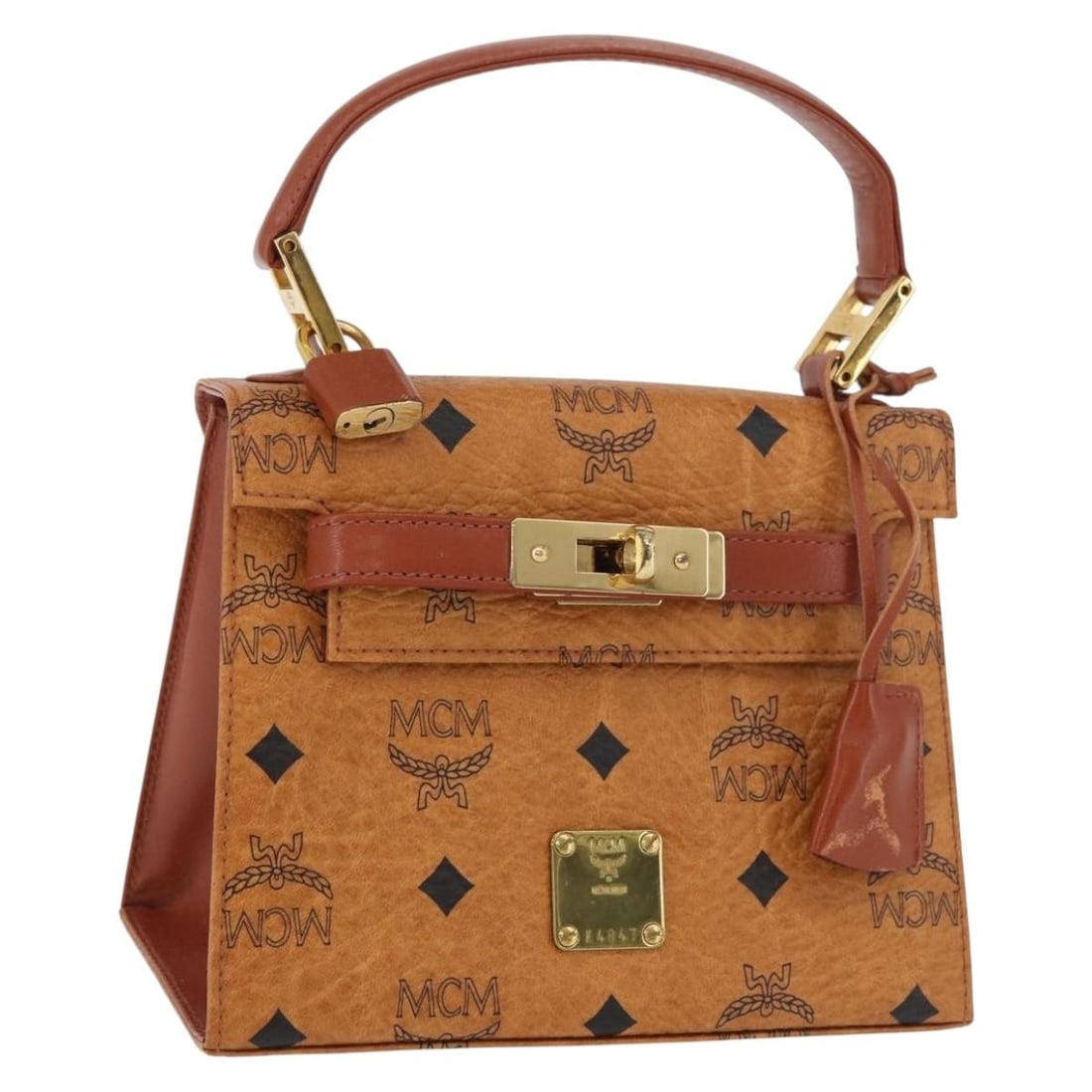 MCM Vicetos Logogram PVC Leather Hand Bag Brown Gold Germany: MCM Vicetos Logogram PVC Leather Hand Bag Brown Gold Germany MCM Vicetos logogram handbag in brown and gold PVC leather. This women's handbag is made in Germany and includes a padlock, two keys, and a
