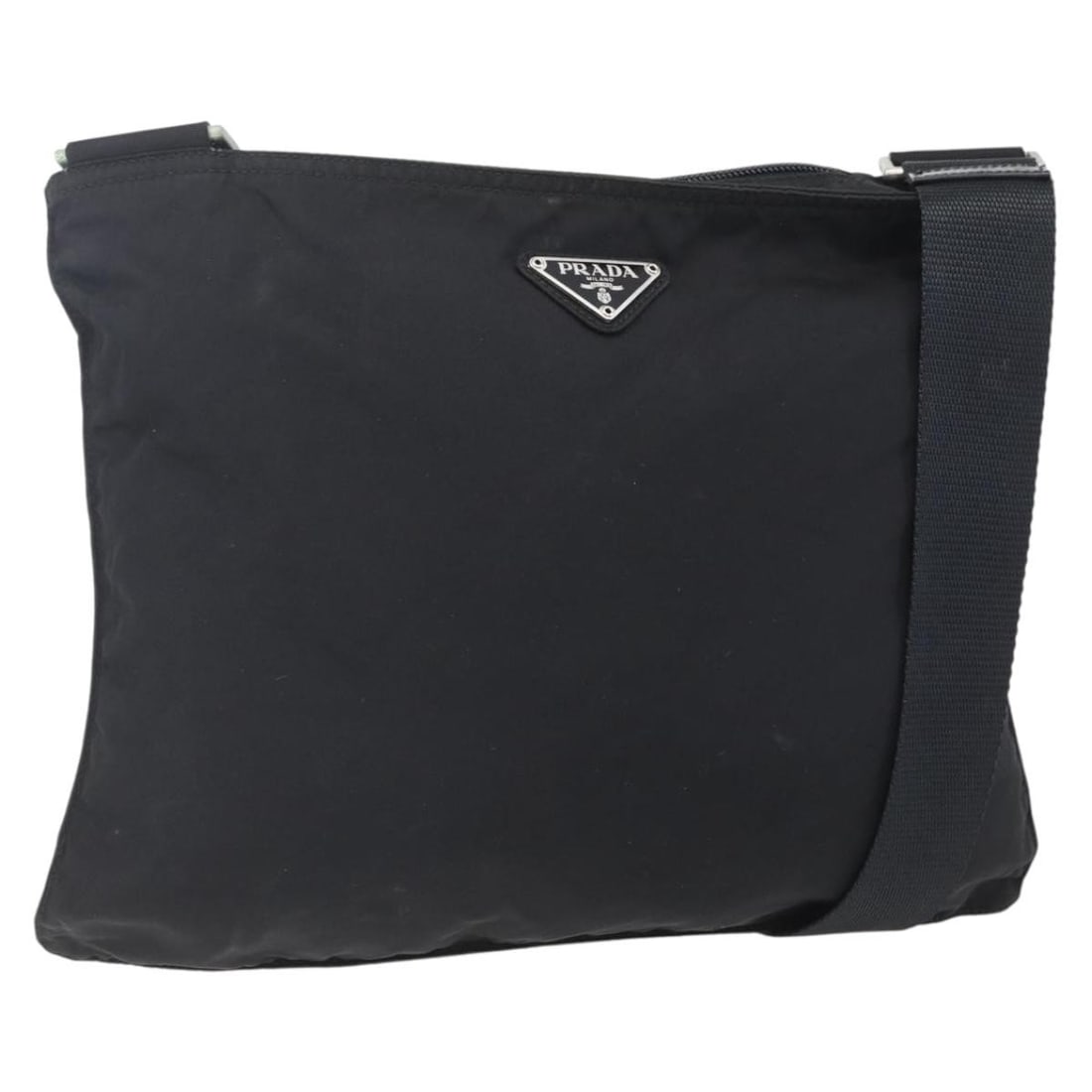 PRADA Black Silver Nylon Shoulder Bag Italy Authentic: PRADA Black Silver Nylon Shoulder Bag Italy Authentic This authentic PRADA shoulder bag combines style and functionality with its sleek black nylon exterior accented by silver details. Measuring appro