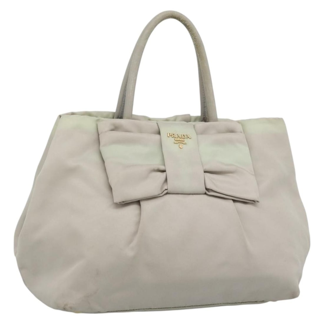 PRADA Ivory Nylon Hand Bag Gold Tone Italy: PRADA Ivory Nylon Hand Bag Gold Tone Italy Prada women's handbag in ivory nylon with gold-tone accents, made in Italy. This handbag is offered without the original box or dust bag; only the item shown