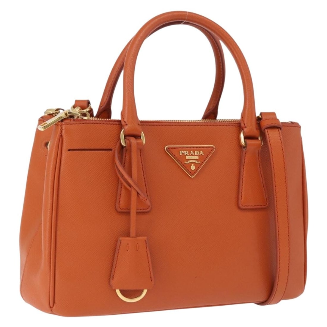 PRADA Saffiano Leather 2 Way Handbag Orange with Shoulder Strap: PRADA Saffiano Leather 2 Way Handbag Orange with Shoulder Strap Prada women's 2-way handbag in orange Saffiano leather with gold-tone accents. Made in Italy, this bag includes a clochette and shoulder