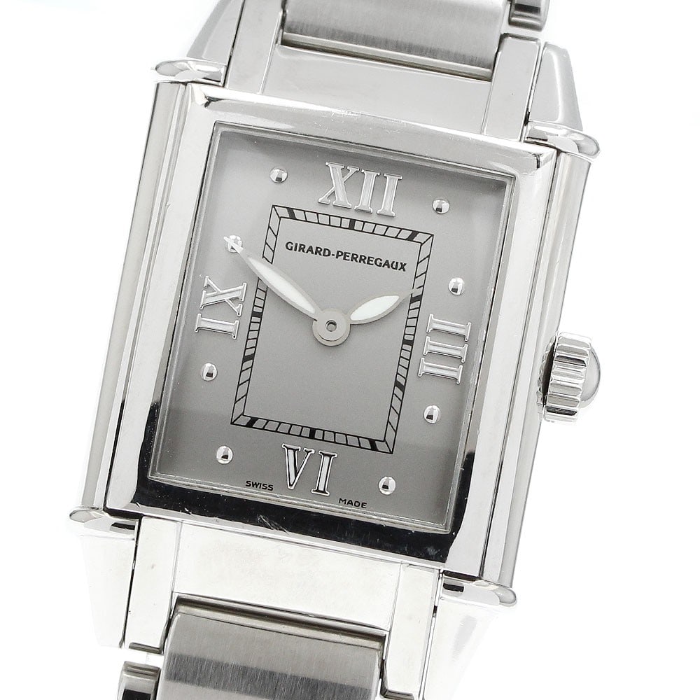 Girard Perregaux Ref 2574 Vintage 1945 Quartz Stainless Steel Wristwatch: Girard Perregaux Ref 2574 Vintage 1945 Quartz Stainless Steel Wristwatch Pre-owned Girard-Perregaux Vintage 1945 quartz wristwatch, reference 2574. This unisex watch features a gray dial and stainless