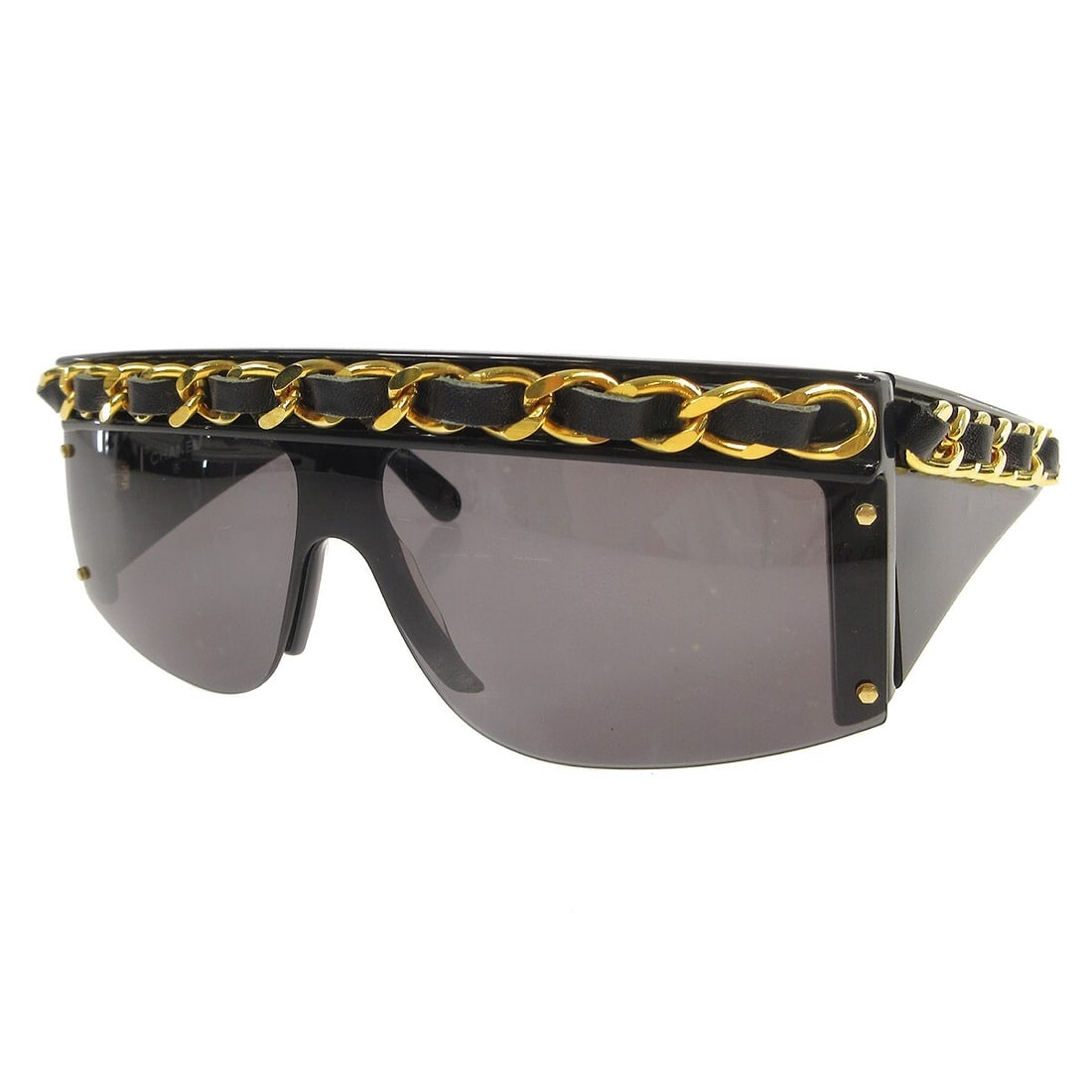 CHANEL 01455 94305 square sunglasses black chain accent: CHANEL 01455 94305 square sunglasses black chain accent Square sunglasses by Chanel featuring a black frame with black lenses and chain detailing. Made in Italy, this women's eyewear combines metal an