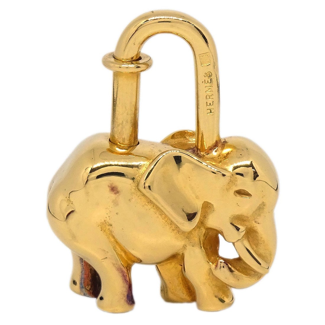 Hermes Elephant Cadena Charm 1988 Gold Plated with Box: Hermes Elephant Cadena Charm 1988 Gold Plated with Box Vintage gold-plated elephant motif cadena lock bag charm from France. It is described as a charm with a gold finish and comes with a box. The ext