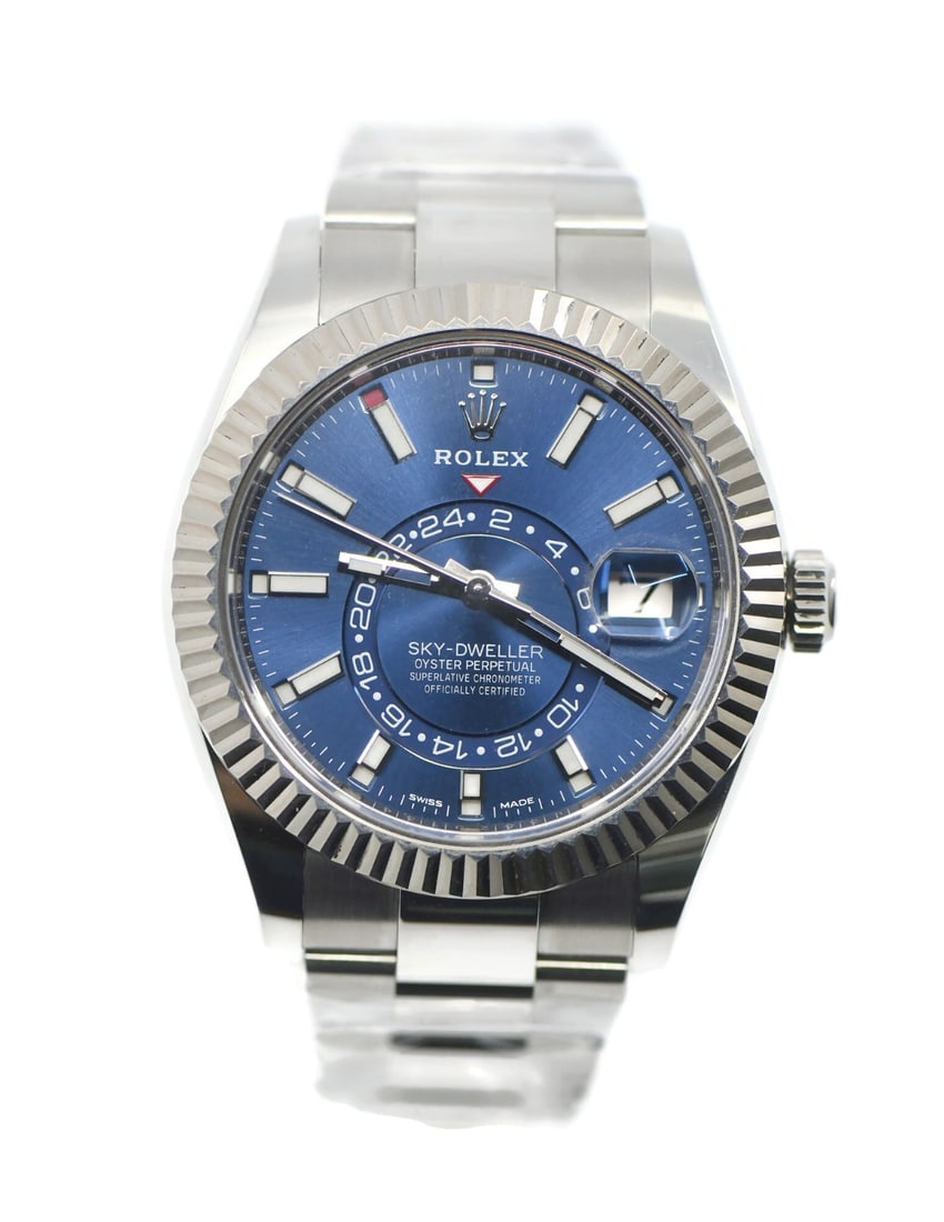 Rolex 326934 Sky-Dweller blue dial steel wristwatch with box papers: Rolex 326934 Sky-Dweller blue dial steel wristwatch with box papers Pre-owned Rolex Sky-Dweller wristwatch with a blue sunburst dial, fluted bezel, and stainless steel case and bracelet. This automati