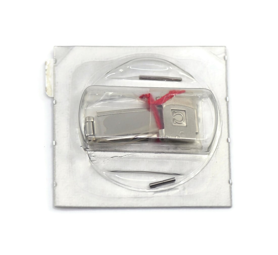 Authentic Omega Stainless Steel Buckle for 6168 Wristwatch: Authentic Omega Stainless Steel Buckle for 6168 Wristwatch Enhance your timepiece with this authentic Omega Stainless Steel Buckle 6168. Crafted from high-quality stainless steel, this buckle is desig
