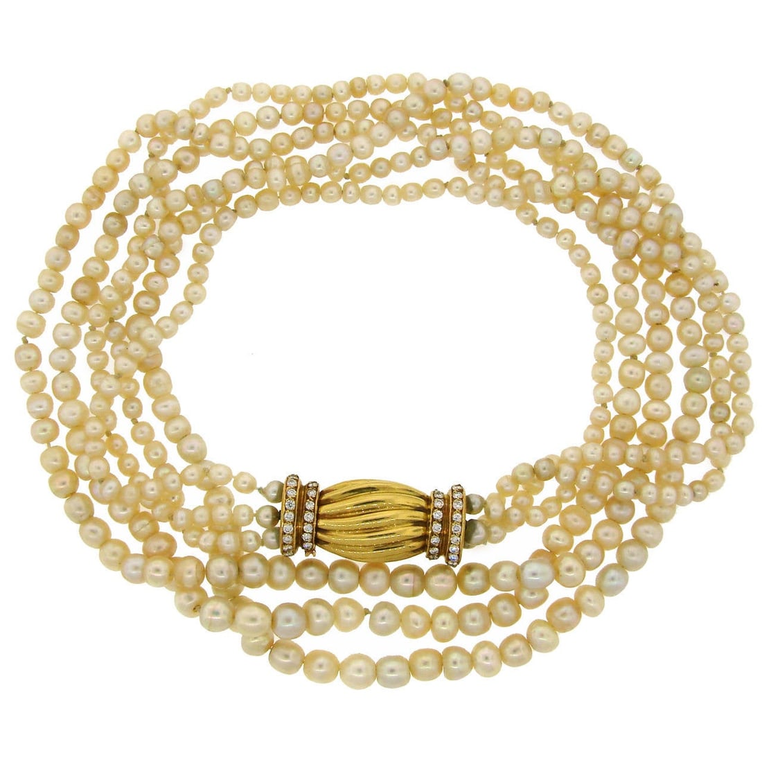 Three Strand Natural Saltwater Pearl Necklace 18k Gold Diamond Clasp: Three Strand Natural Saltwater Pearl Necklace 18k Gold Diamond Clasp Elegant three-strand natural saltwater pearl necklace with a diamond-set 18k yellow gold clasp. The necklace features graduating na