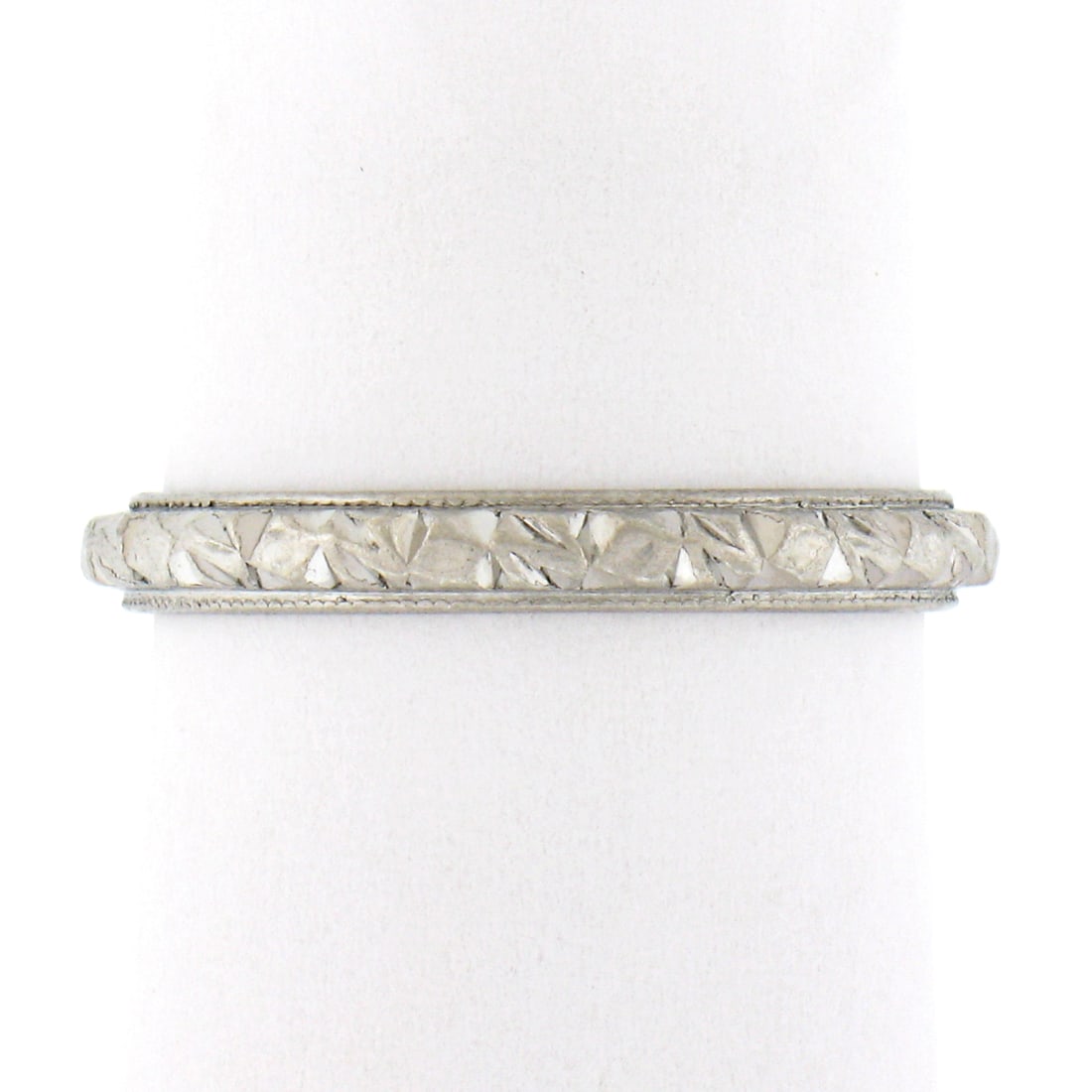 Antique Platinum 2.6mm Textured Eternity Stackable Band Ring: Antique Platinum 2.6mm Textured Eternity Stackable Band Ring This exquisite antique eternity band ring showcases detailed textured work crafted from solid high-grade platinum (.950+). With a band widt