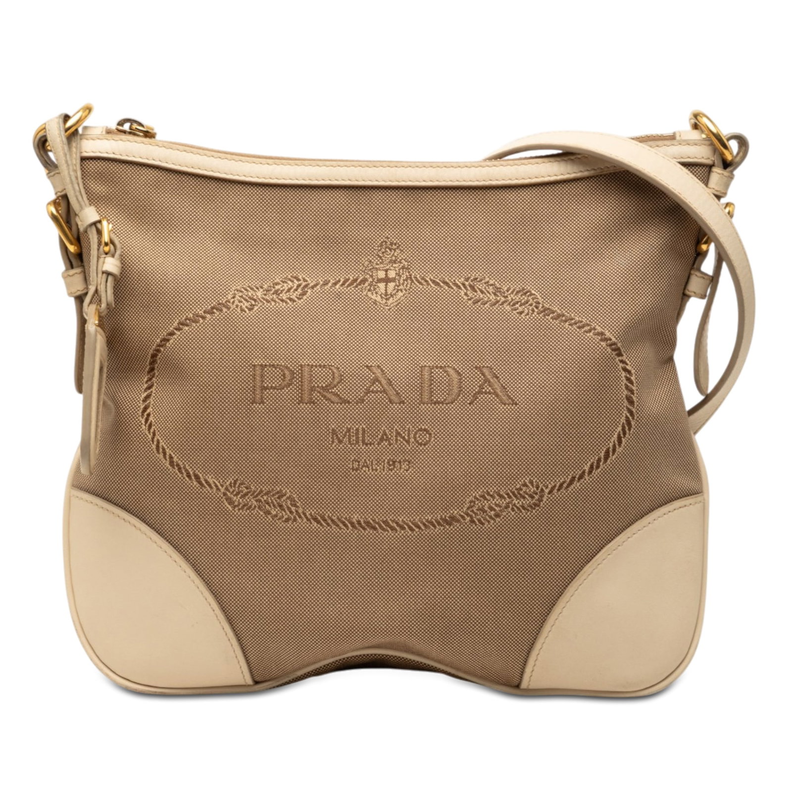 Prada Canapa Logo Canvas Crossbody Bag Brown: Prada Canapa Logo Canvas Crossbody Bag Brown Prada Canvas Canapa Logo Crossbody bag in brown fabric with leather trim. This crossbody style features an adjustable flat leather strap, a top zip closure