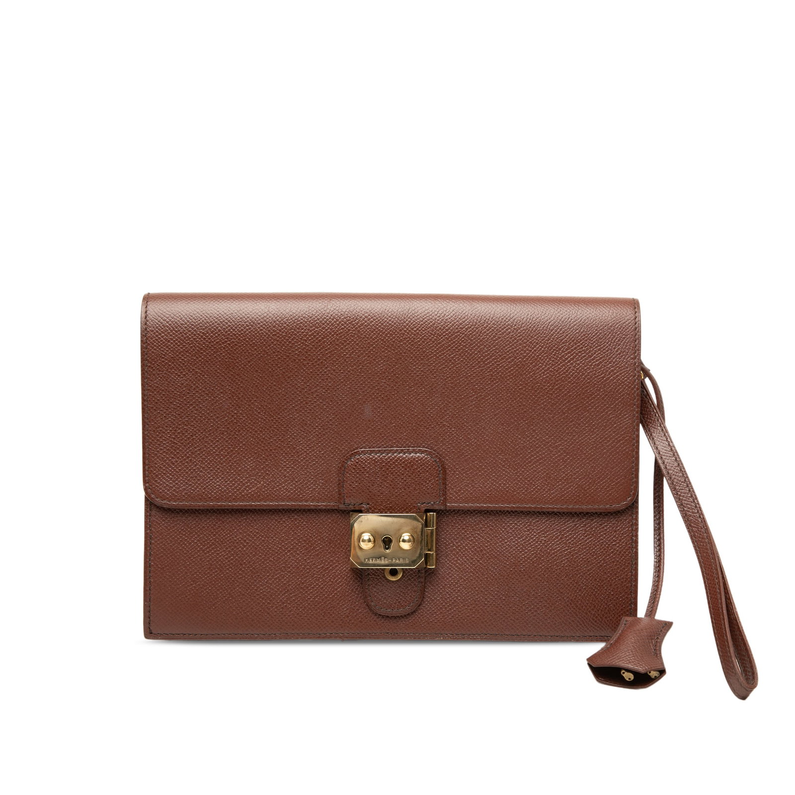 Hermes Jet Pochette wristlet clutch in Courchevel leather: Hermes Jet Pochette wristlet clutch in Courchevel leather Hermes Jet Pochette clutch crafted in Courchevel leather in Meil color. This clutch features a flat leather wrist strap, a front flap with met