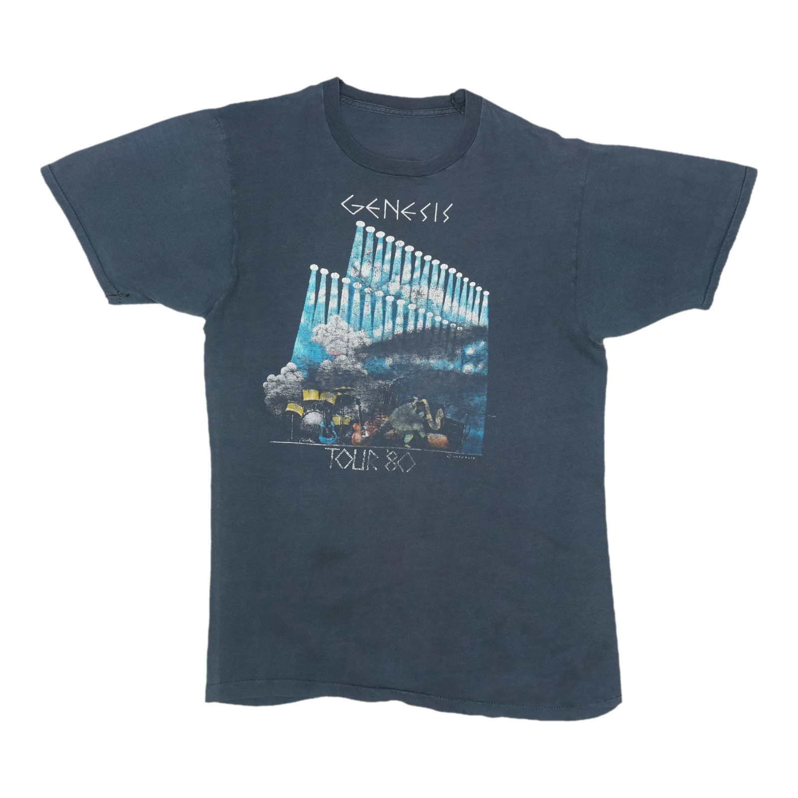 Black 1980s Genesis Tour T Shirt 100% Cotton: Black 1980s Genesis Tour T Shirt 100% Cotton Authentic vintage Genesis tour shirt from the 1980s. This original single-stitch shirt is not a modern reproduction and features no back graphics. It is in