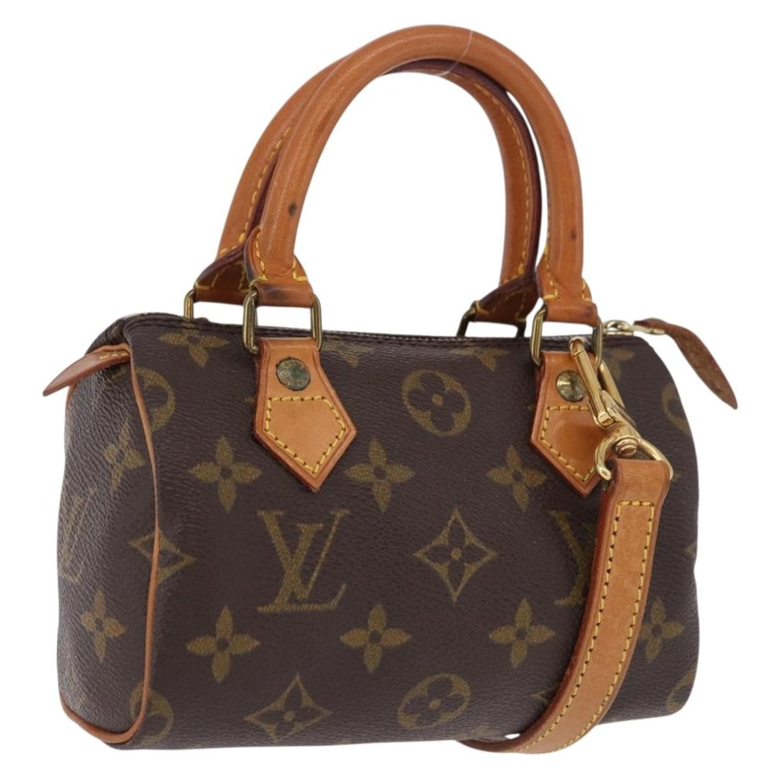 Louis Vuitton M41534 Mini Speedy Monogram Canvas Handbag: Louis Vuitton M41534 Mini Speedy Monogram Canvas Handbag Louis Vuitton Monogram Mini Speedy handbag in Monogram canvas with a compact silhouette and included dust bag and shoulder strap. Made in Franc